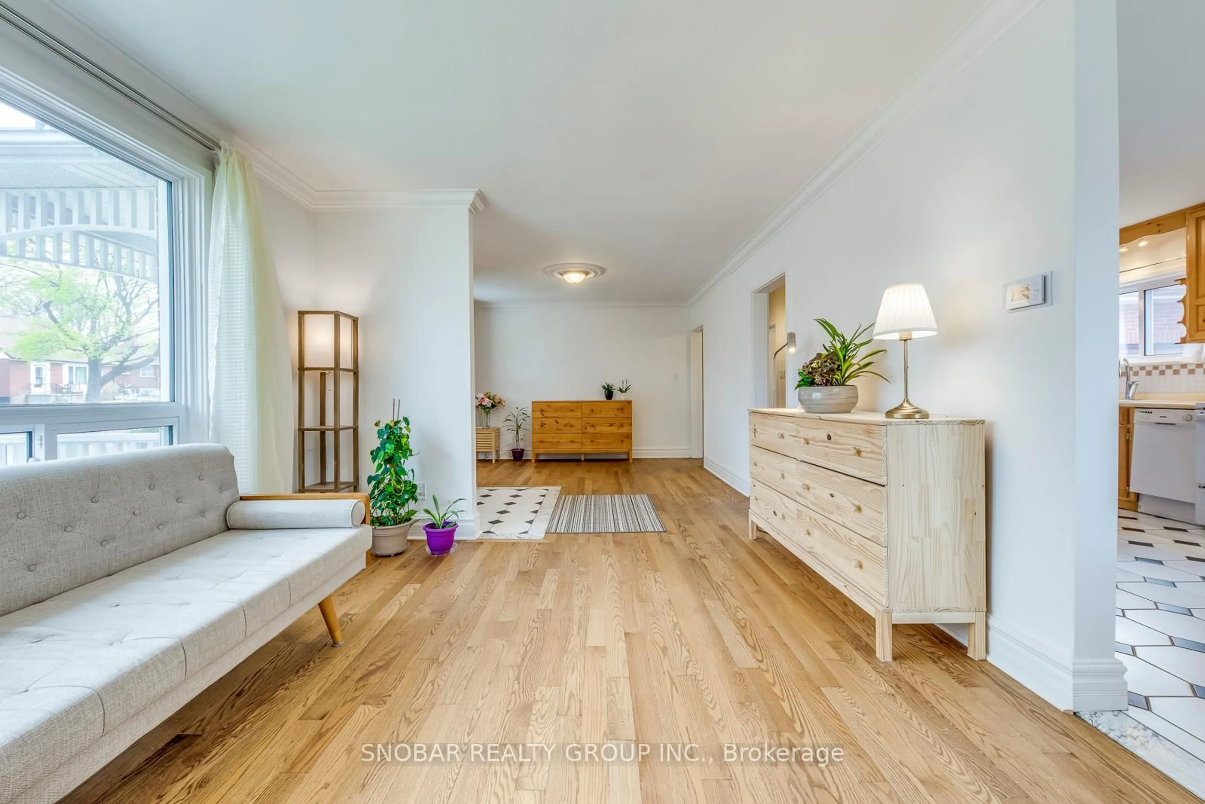 Living room with furniture, wood/laminate floor for 195 Clearbrooke Circ, Toronto Ontario M9W 2G5
