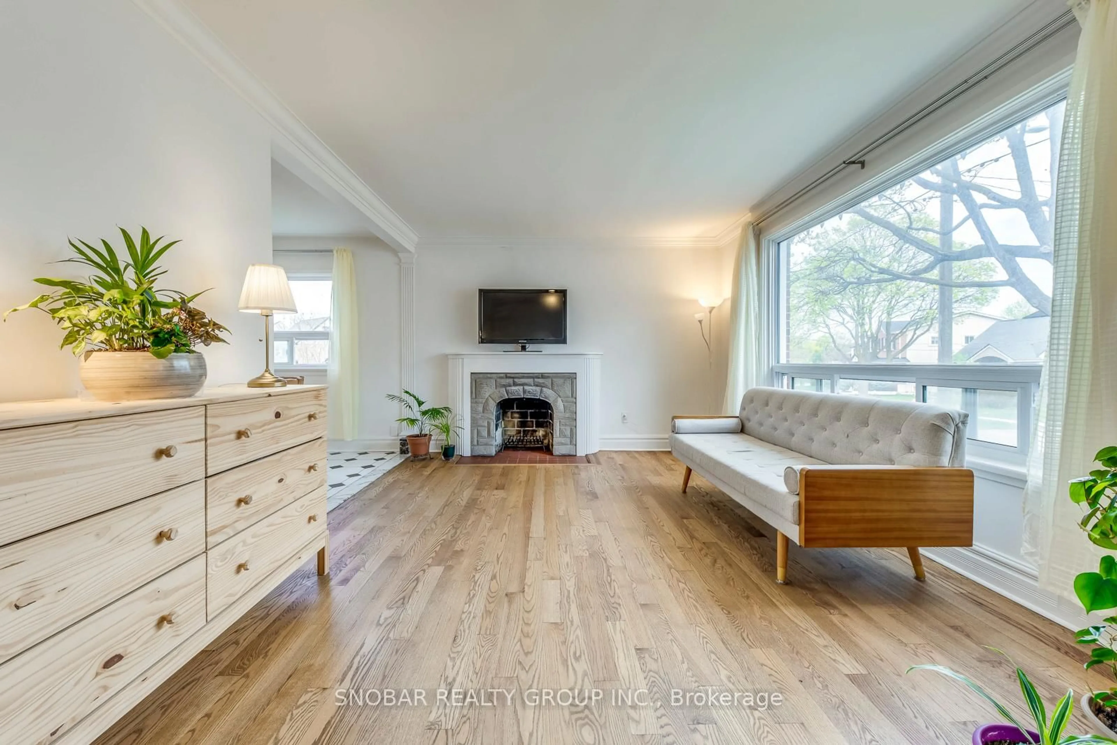 Living room with furniture, wood/laminate floor for 195 Clearbrooke Circ, Toronto Ontario M9W 2G5