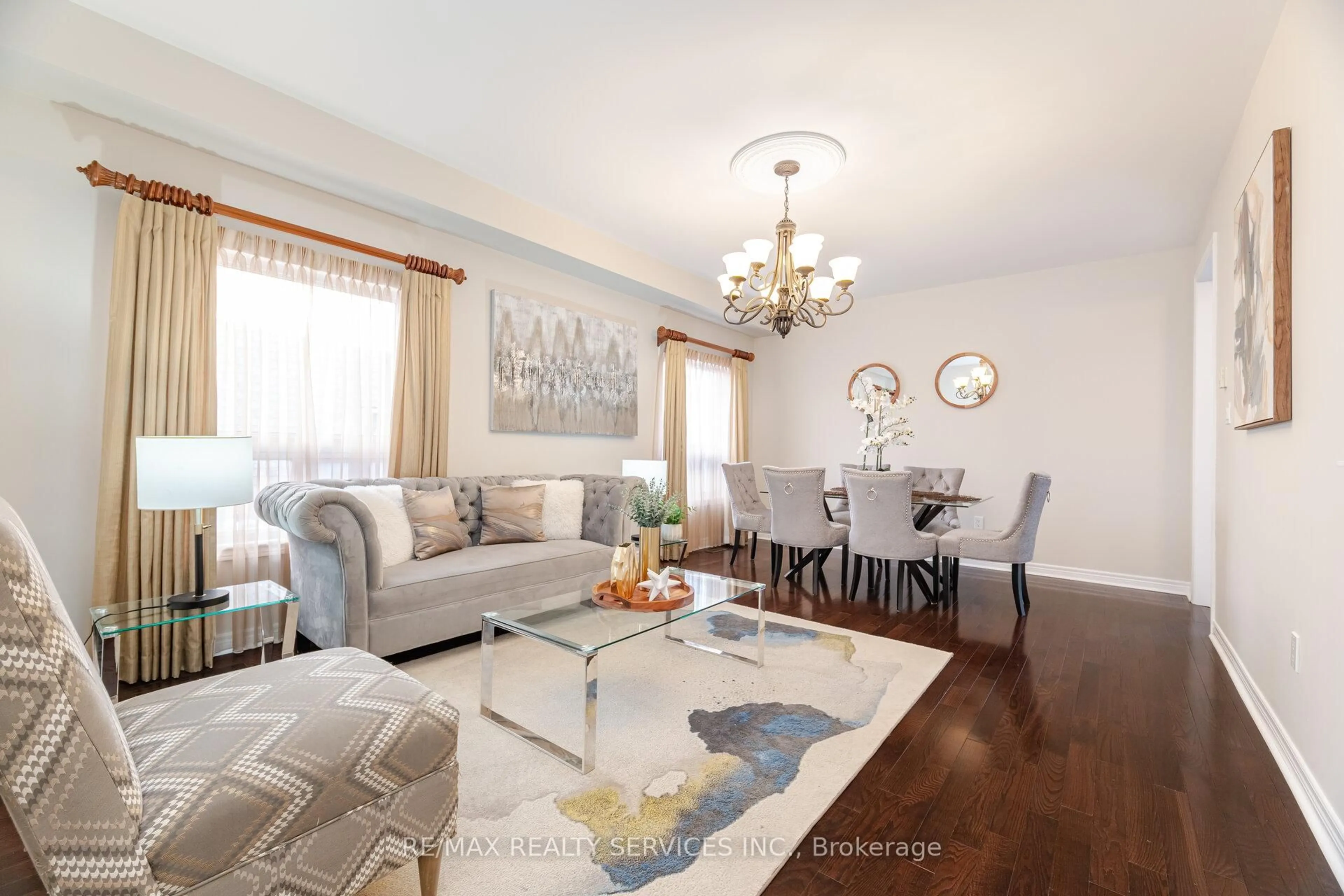 Living room with furniture, wood/laminate floor for 21 Fallgate Dr, Brampton Ontario L6X 0R6