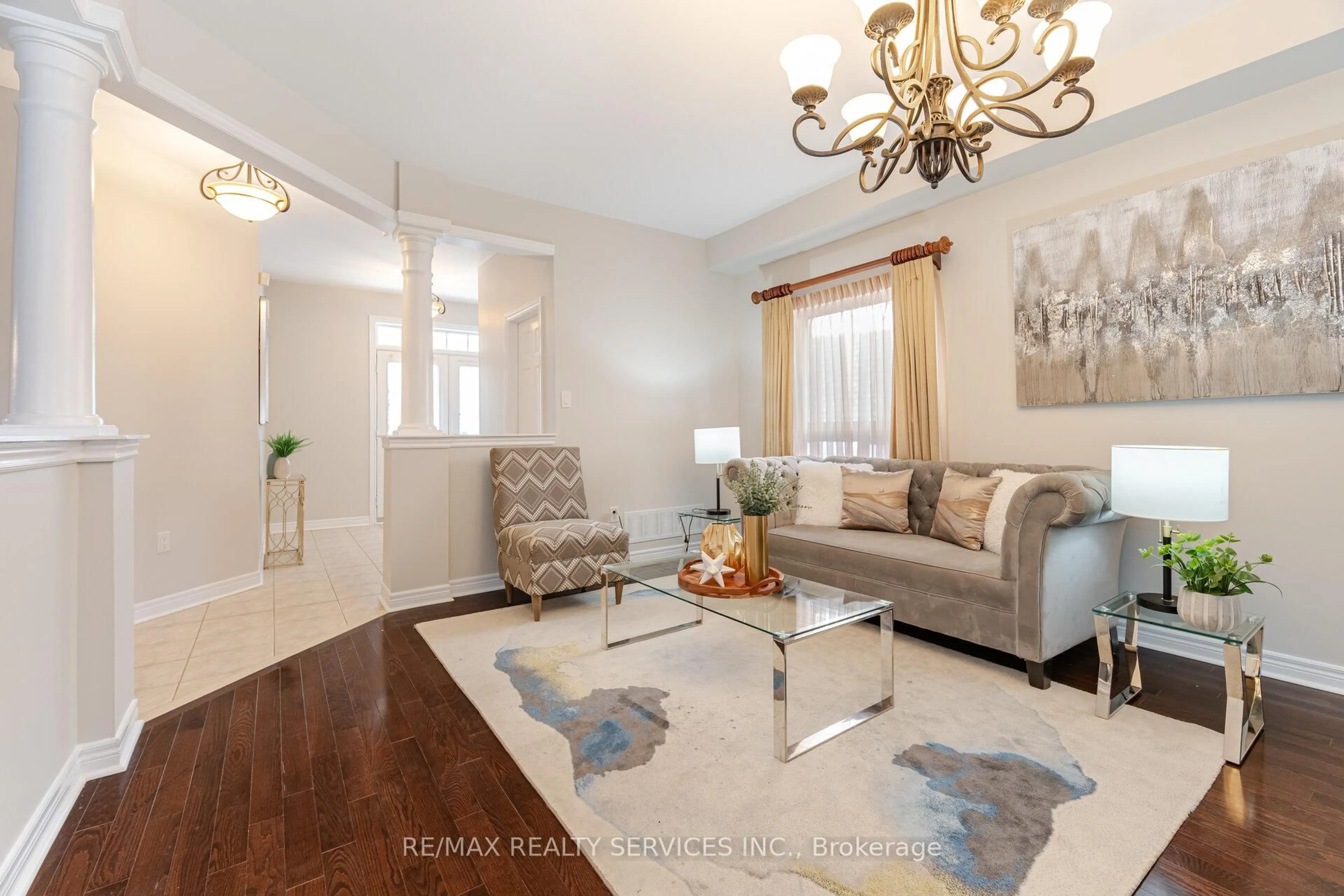 Living room with furniture, wood/laminate floor for 21 Fallgate Dr, Brampton Ontario L6X 0R6