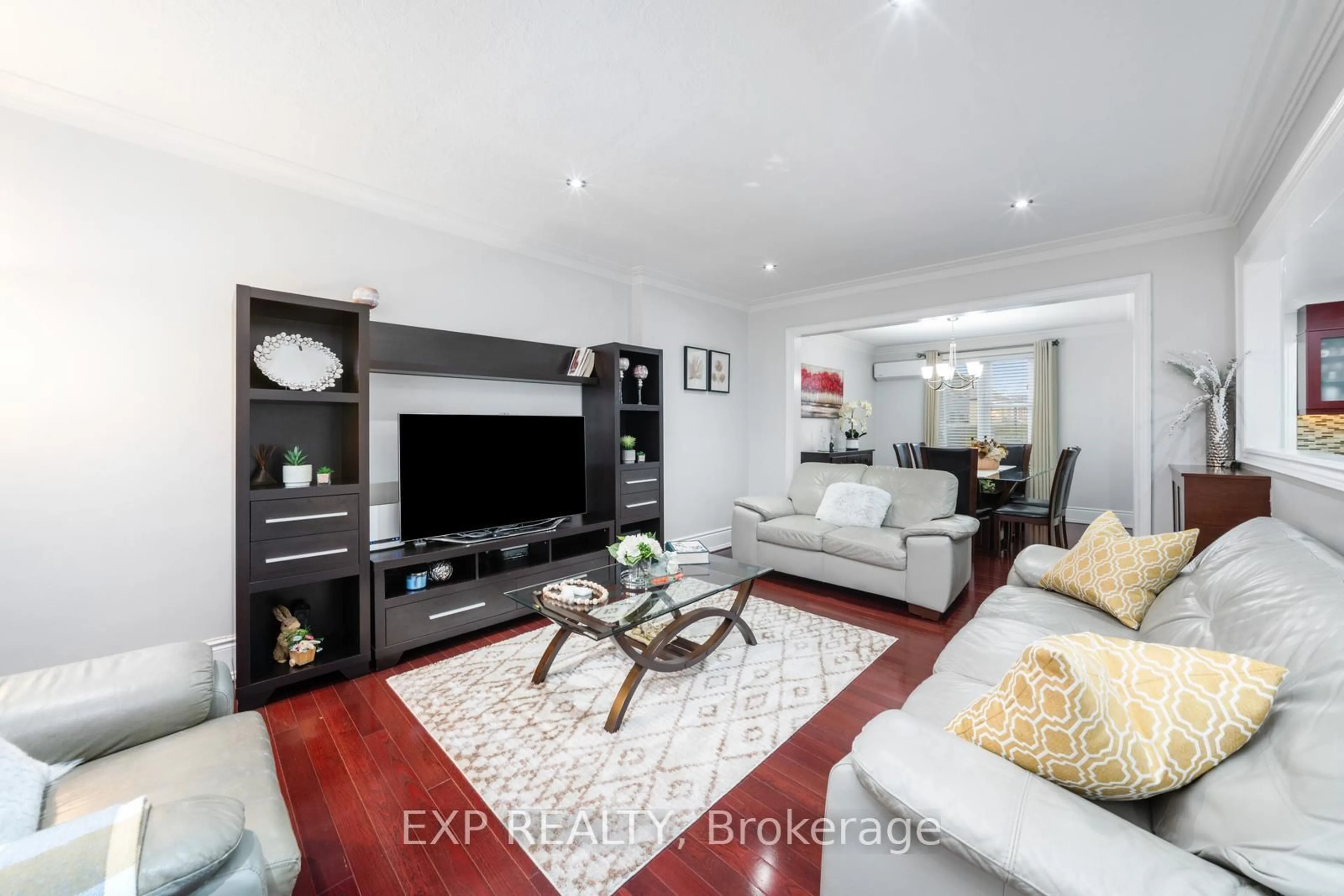Living room with furniture, wood/laminate floor for 2067 Eglinton Ave, Toronto Ontario M6E 2K6