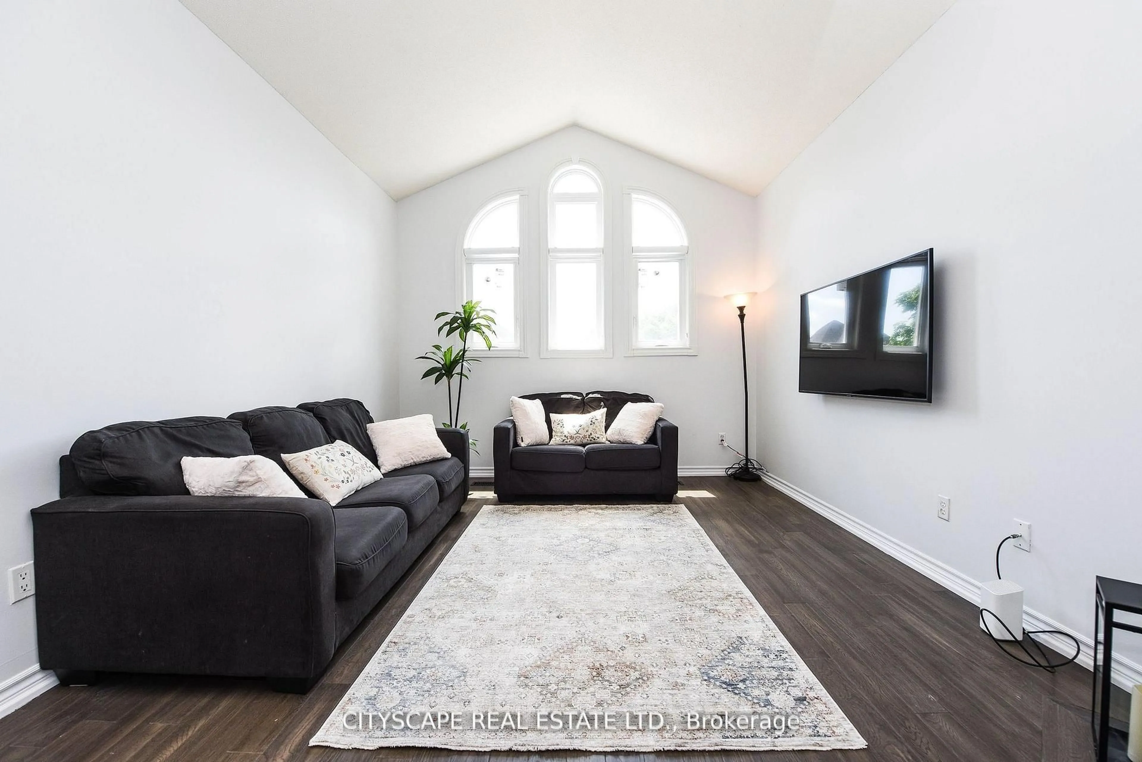 Living room with furniture, wood/laminate floor for 6037 Clover Ridge Cres, Mississauga Ontario L5N 7B4