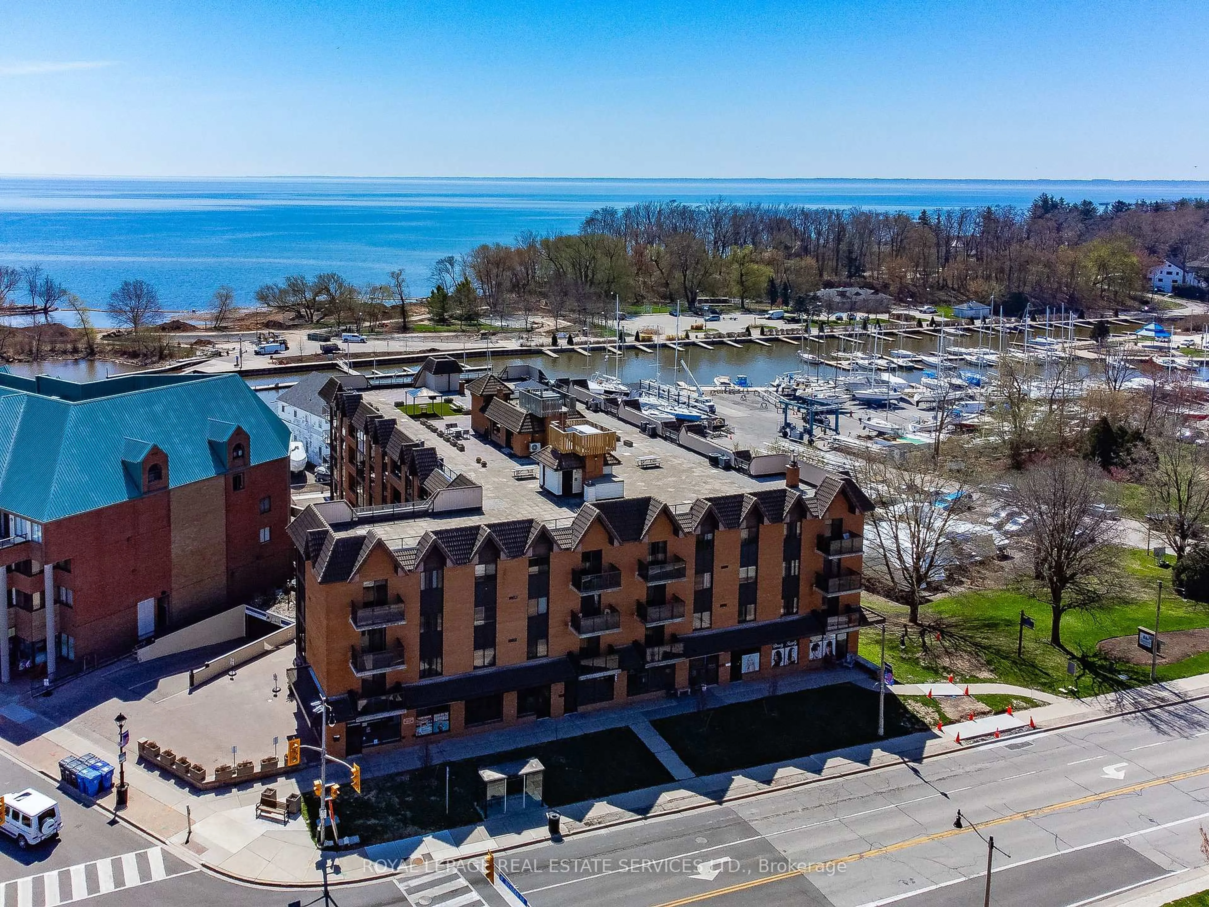 A pic from outside/outdoor area/front of a property/back of a property/a pic from drone, water/lake/river/ocean view for 102 Bronte Rd #215, Oakville Ontario L6L 6J5