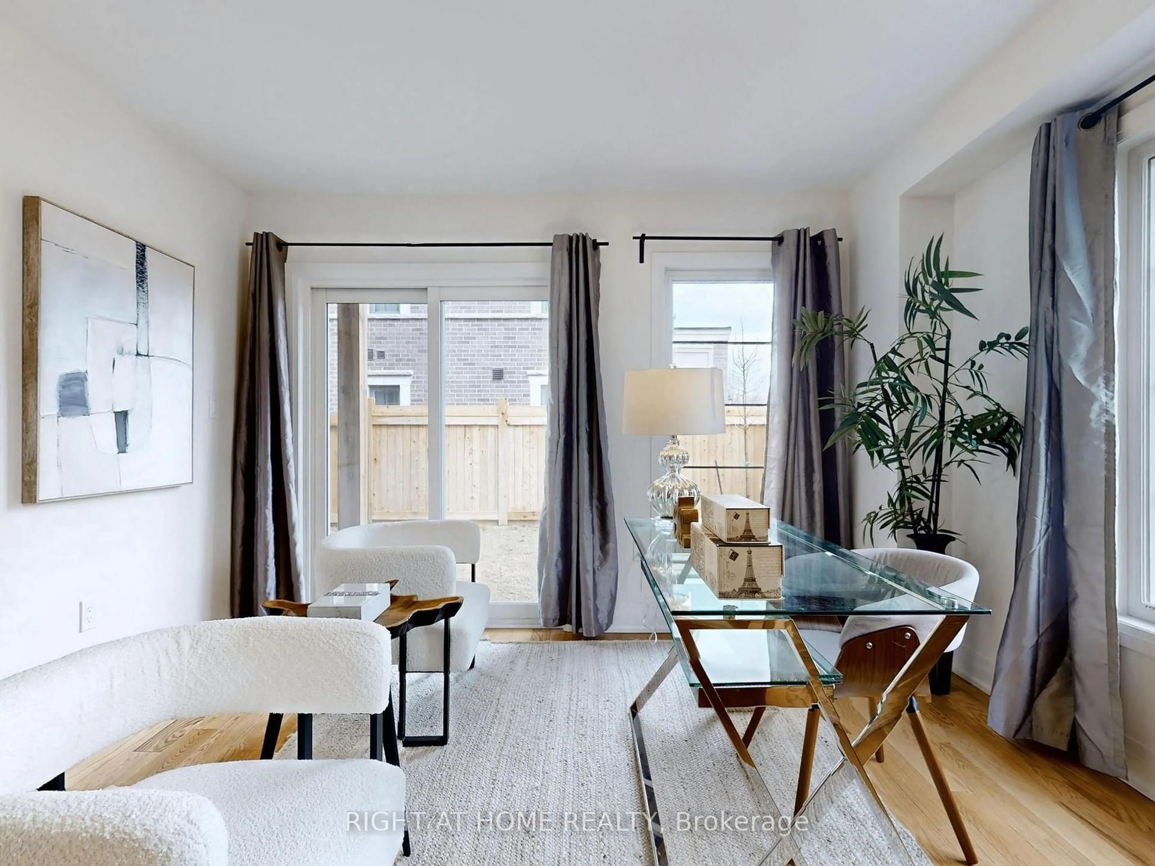Living room with furniture, wood/laminate floor for 211 Wyndham St, Mississauga Ontario L5M 2S5