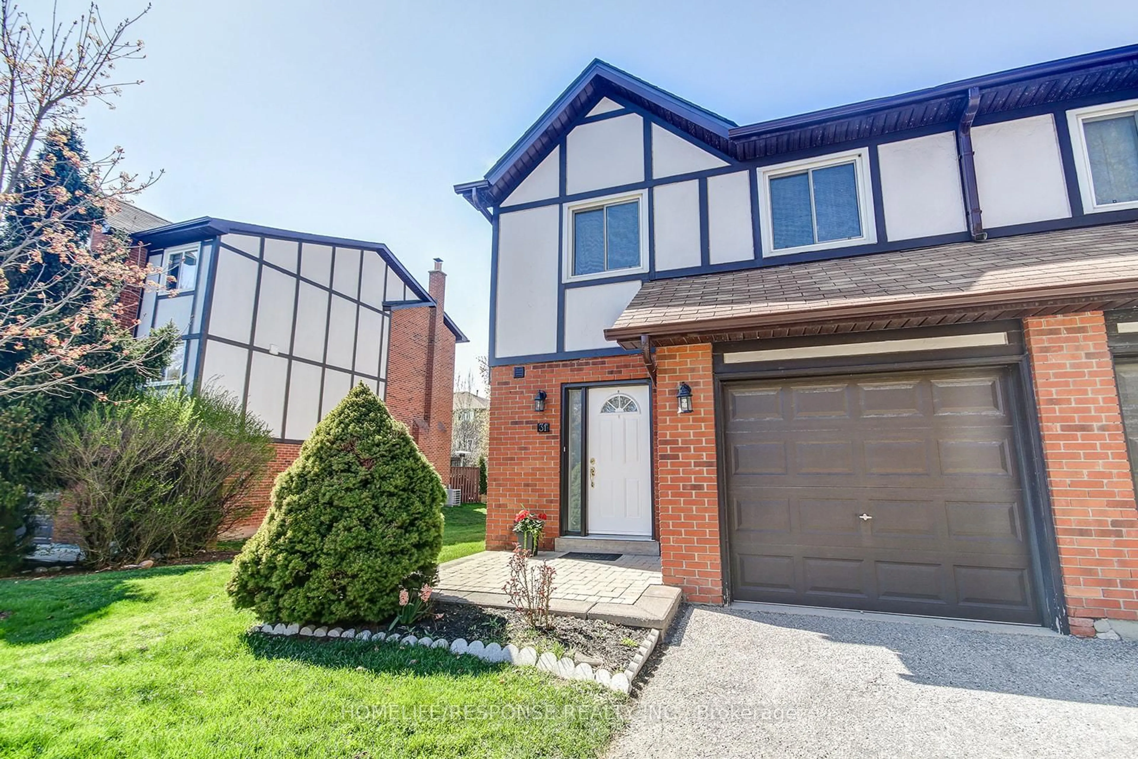 Home with brick exterior material, street for 1755 RATHBURN Rd #31, Mississauga Ontario L4W 2M8