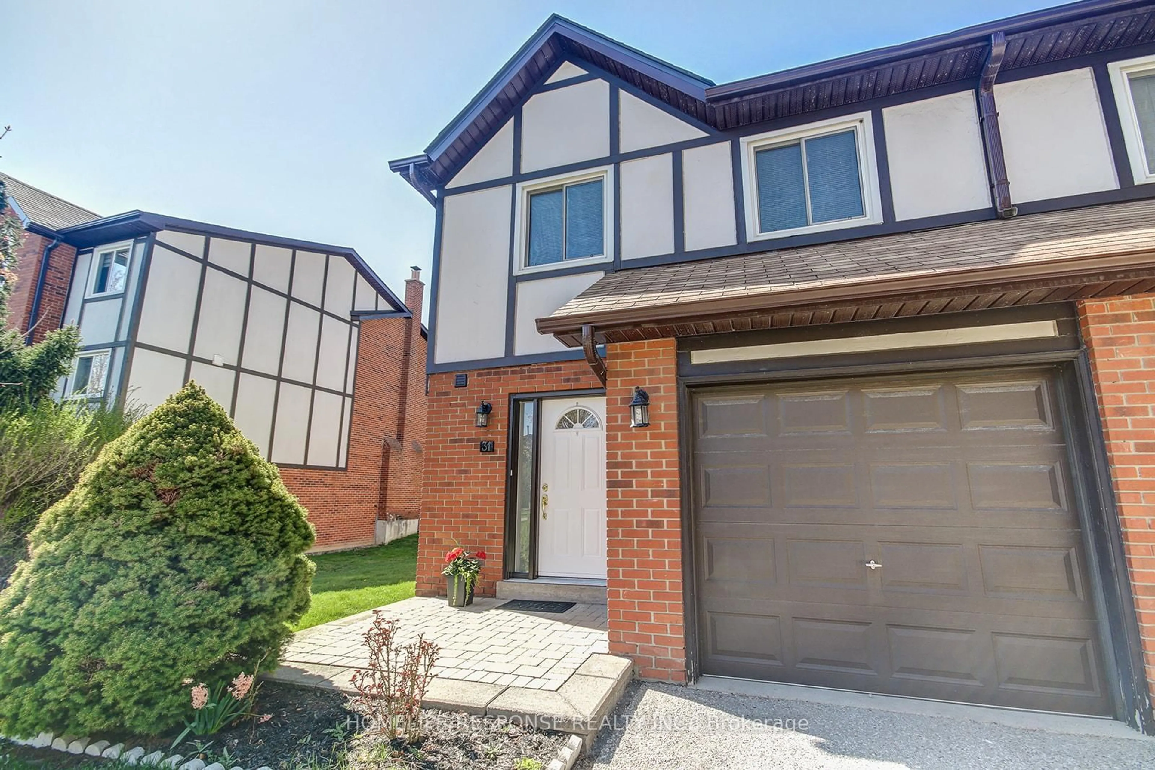 Home with brick exterior material, street for 1755 RATHBURN Rd #31, Mississauga Ontario L4W 2M8