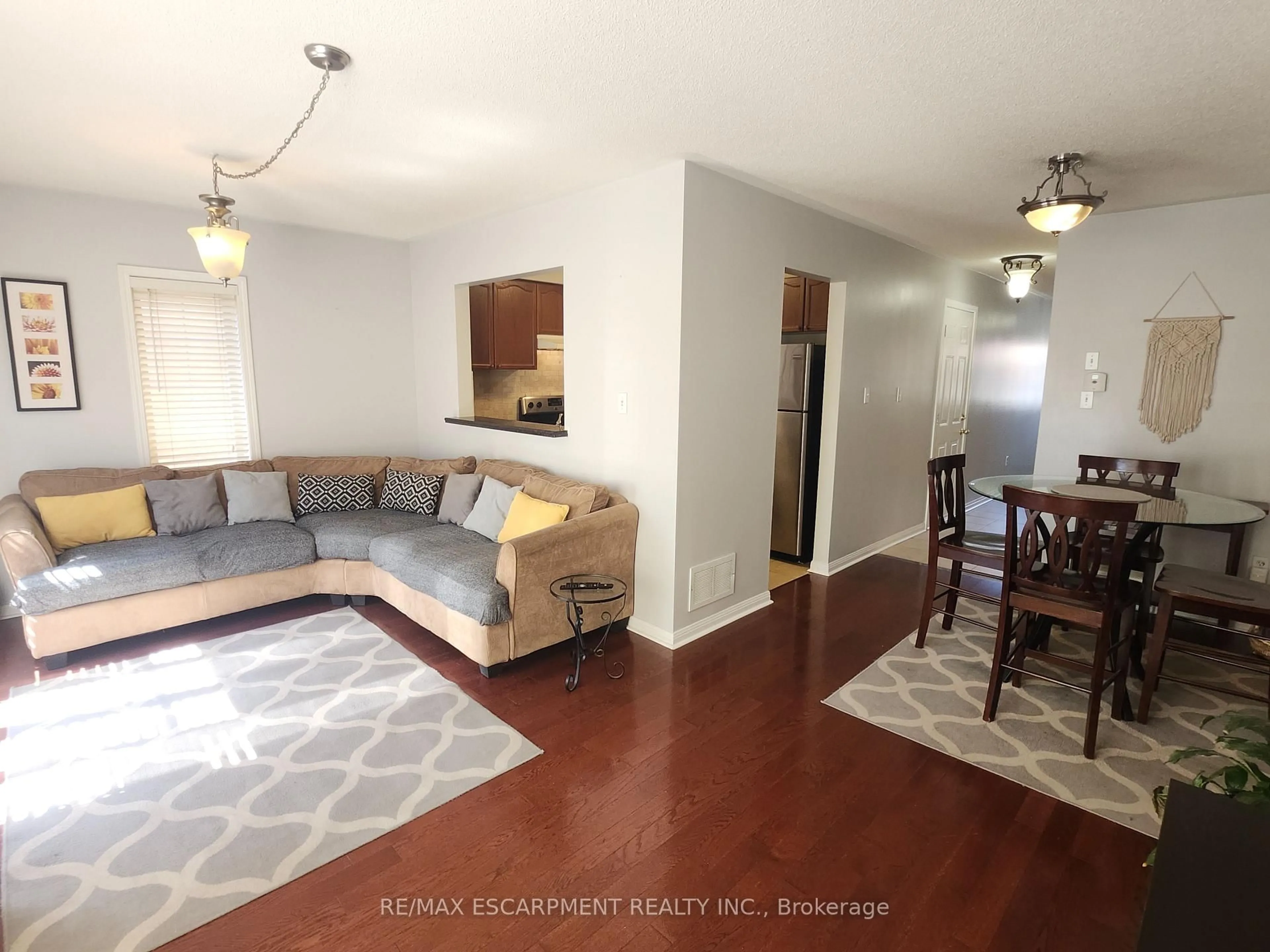 Living room with furniture, wood/laminate floor for 4324 FAIRVIEW St, Burlington Ontario L7L 7A2