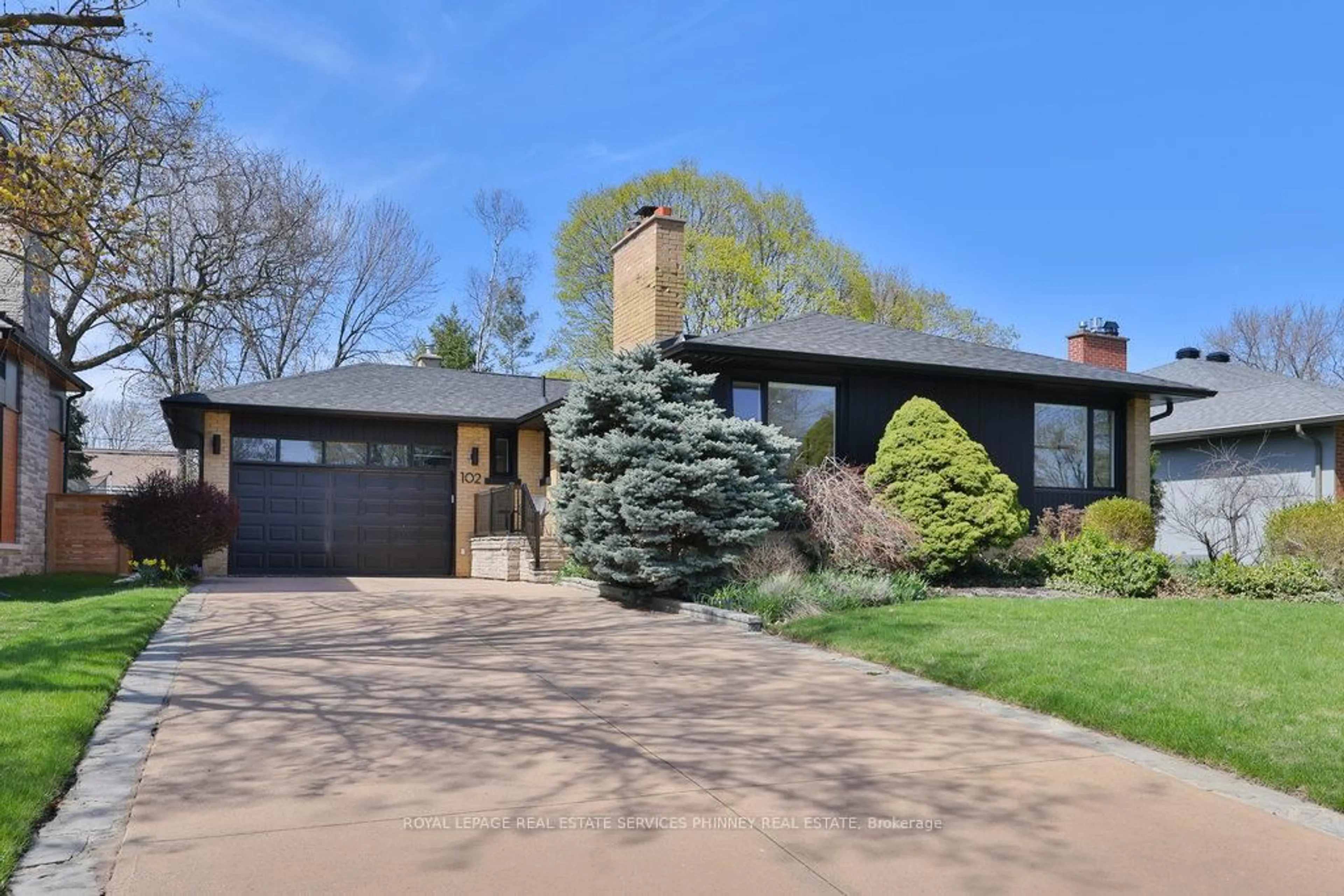 Home with brick exterior material, street for 102 Prince George Dr, Toronto Ontario M9B 2X8