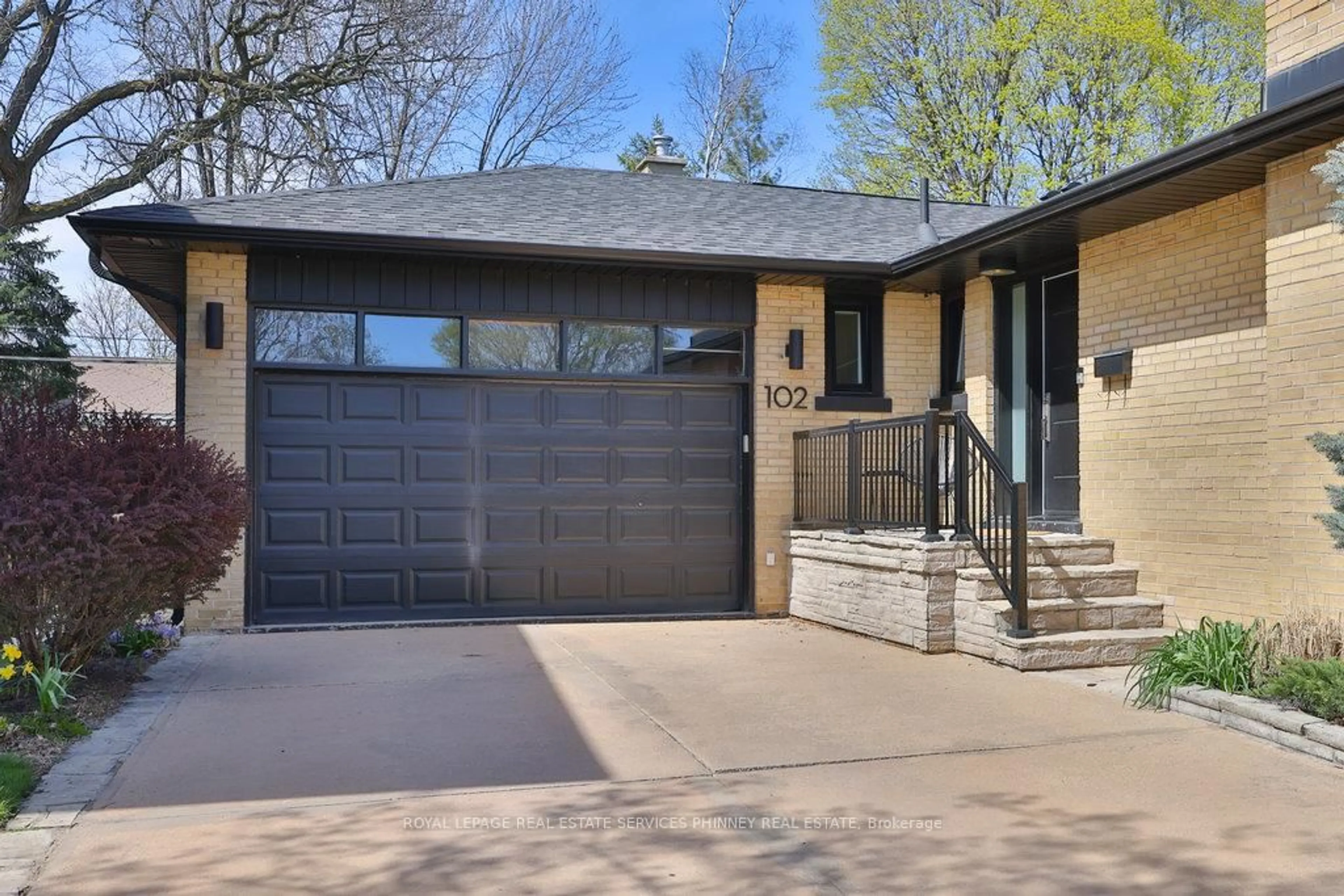 Home with brick exterior material, street for 102 Prince George Dr, Toronto Ontario M9B 2X8