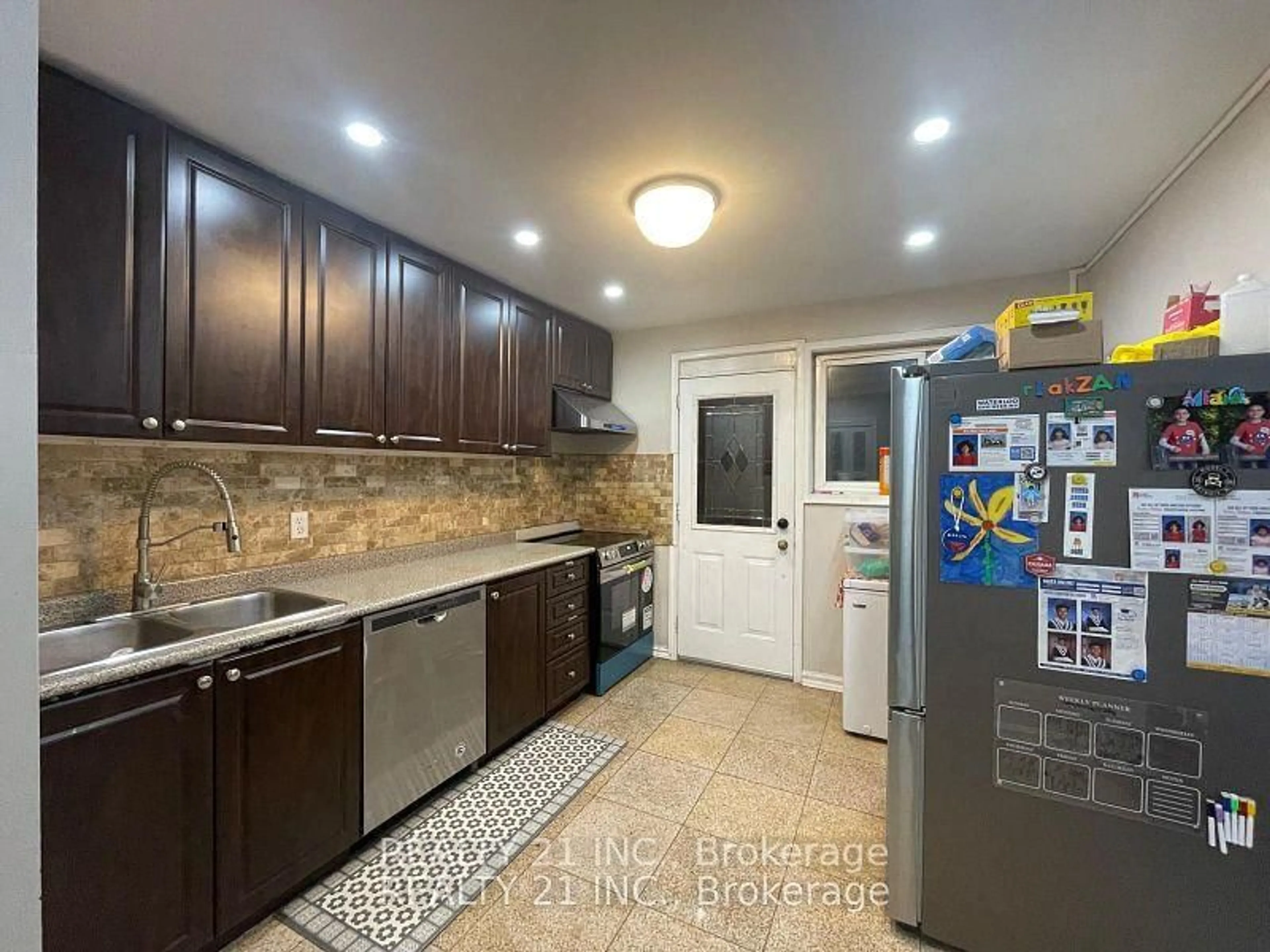 Kitchen with laundary machines, ceramic/tile floor for 75 Taysham Cres, Toronto Ontario M9V 1X1