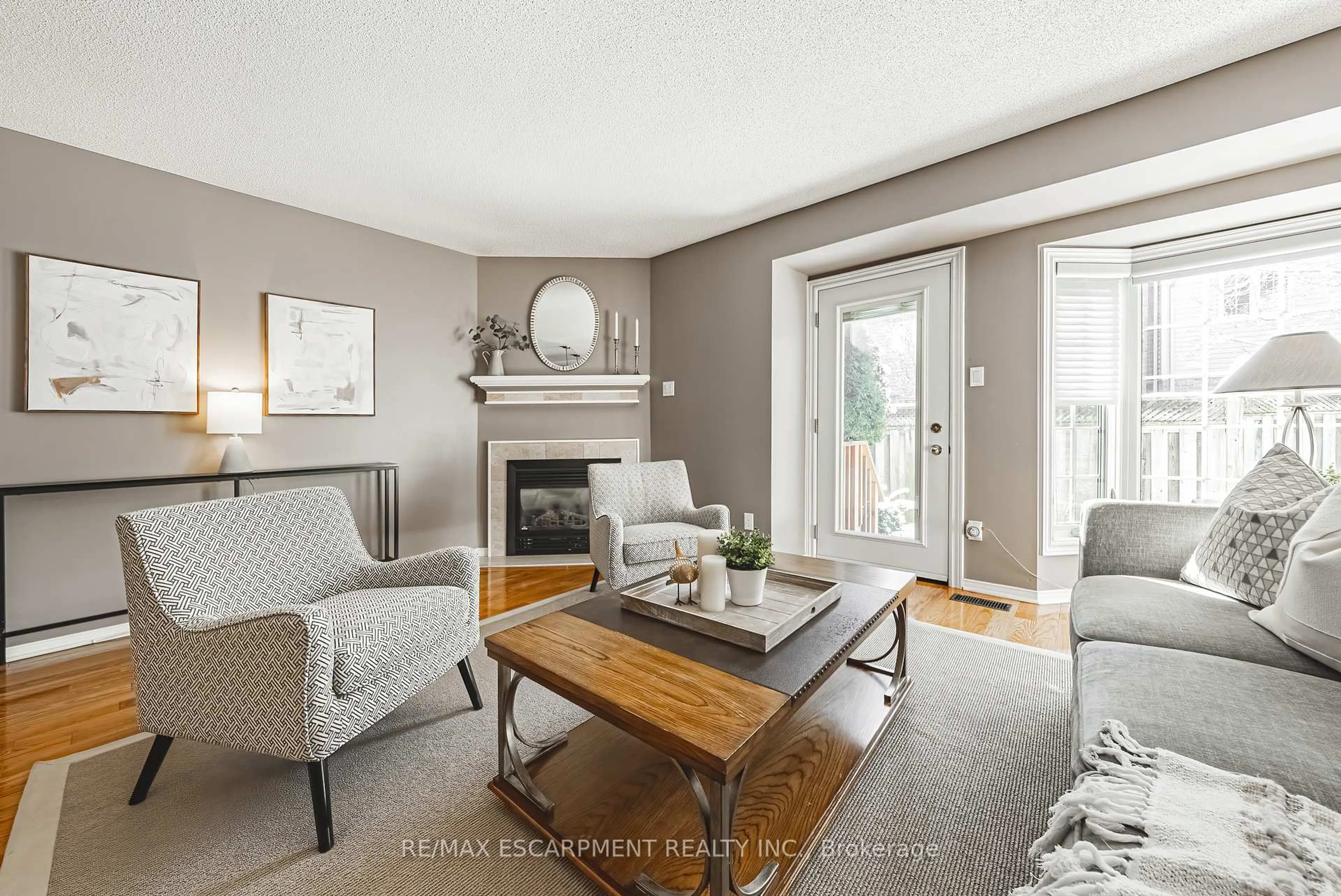 Living room with furniture, wood/laminate floor for 3333 New St #9, Burlington Ontario L7N 1N1