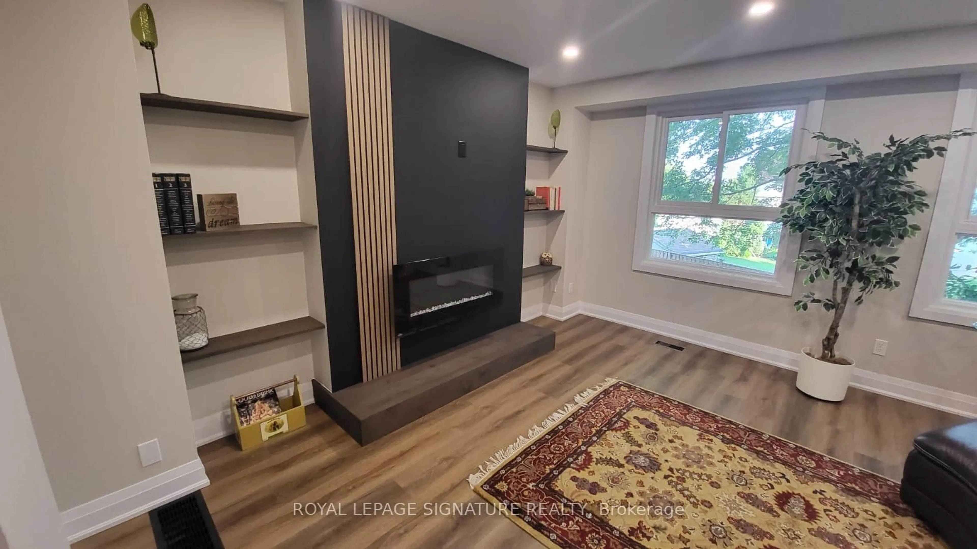 Living room with furniture, wood/laminate floor for 830 Westlock Rd #38A, Mississauga Ontario L5C 1K6