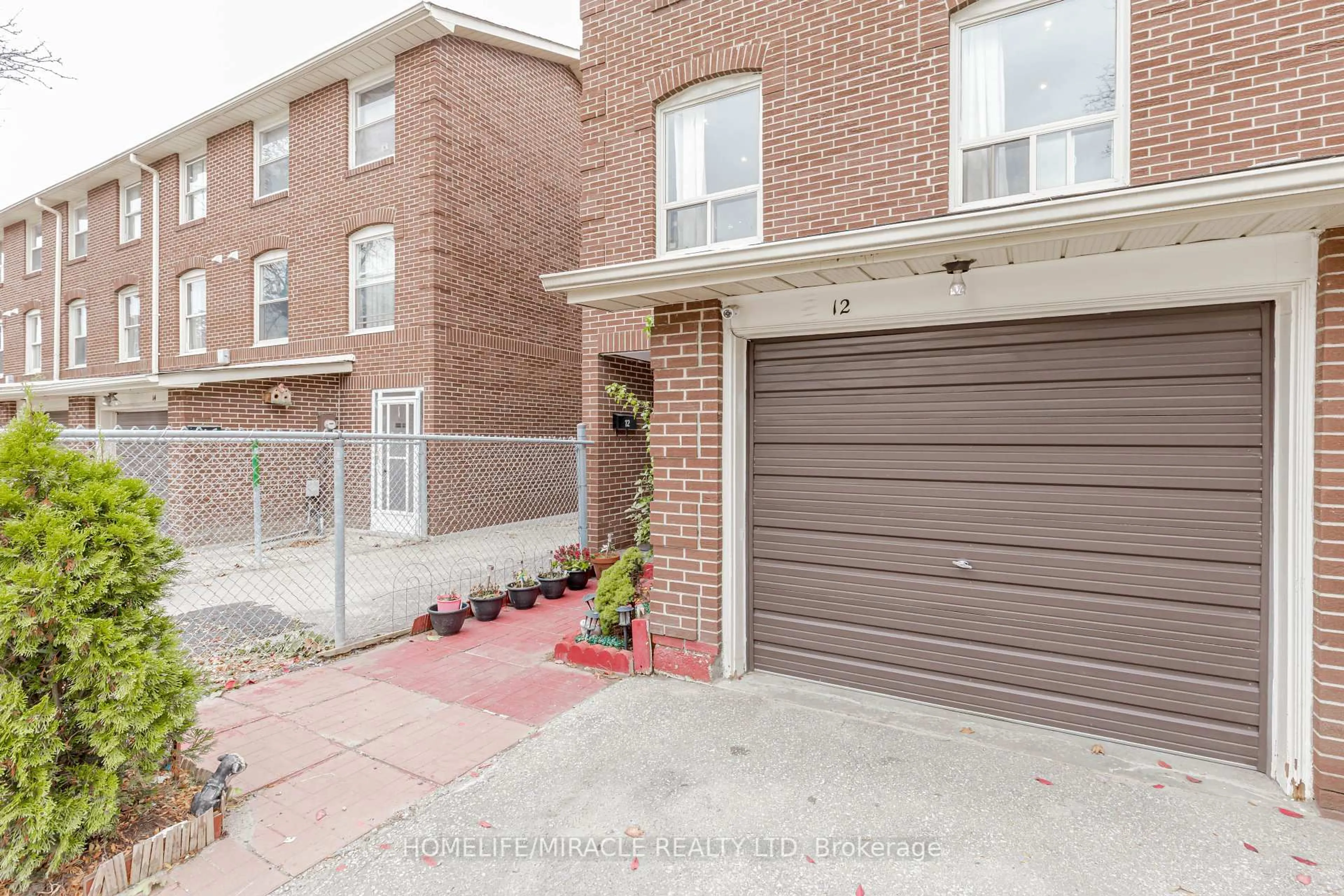 Home with brick exterior material, street for 12 Eden Park #12, Brampton Ontario L6T 3A5