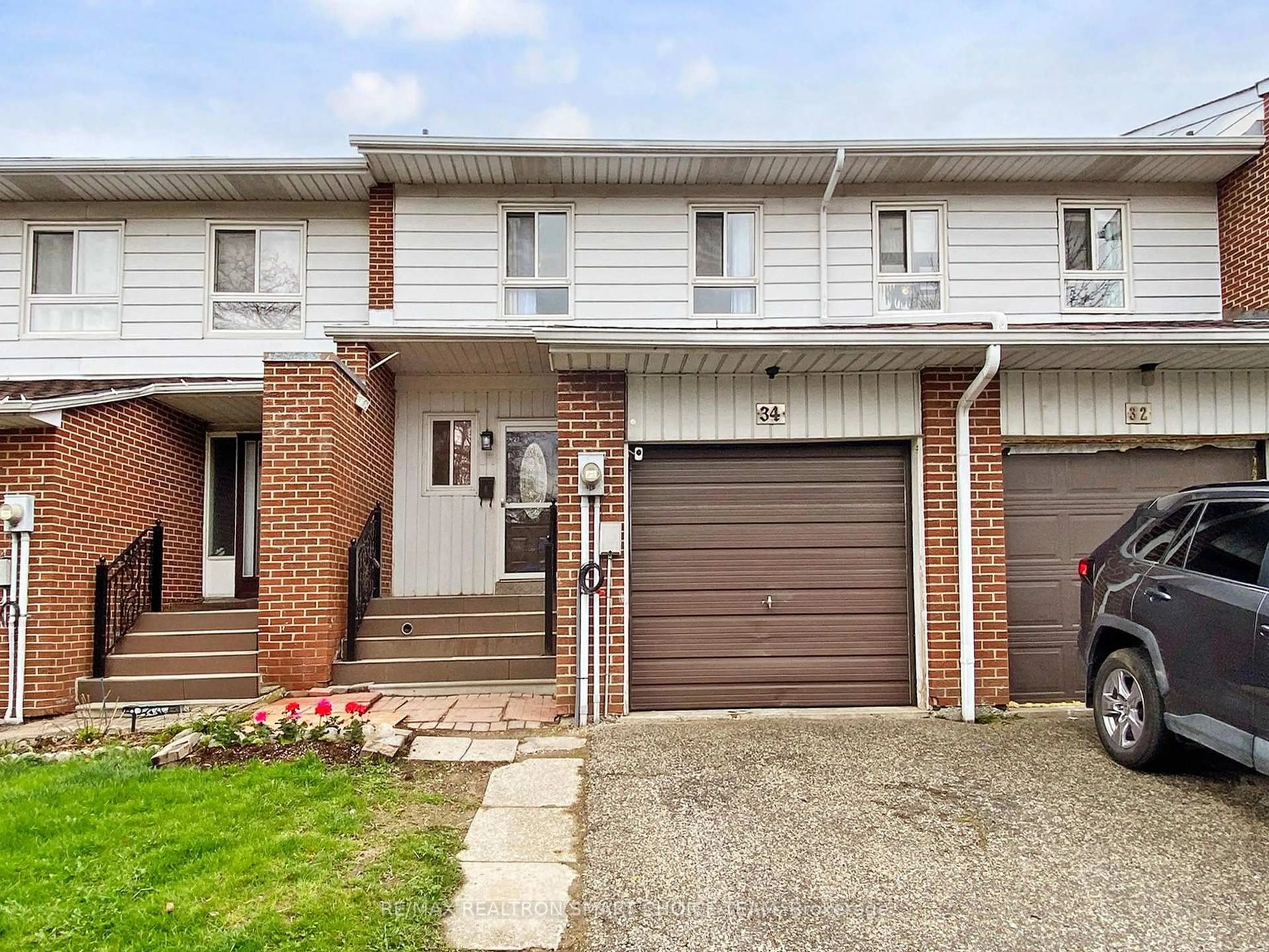 Home with brick exterior material, street for 34 San Marino Way, Toronto Ontario M3N 2Y3