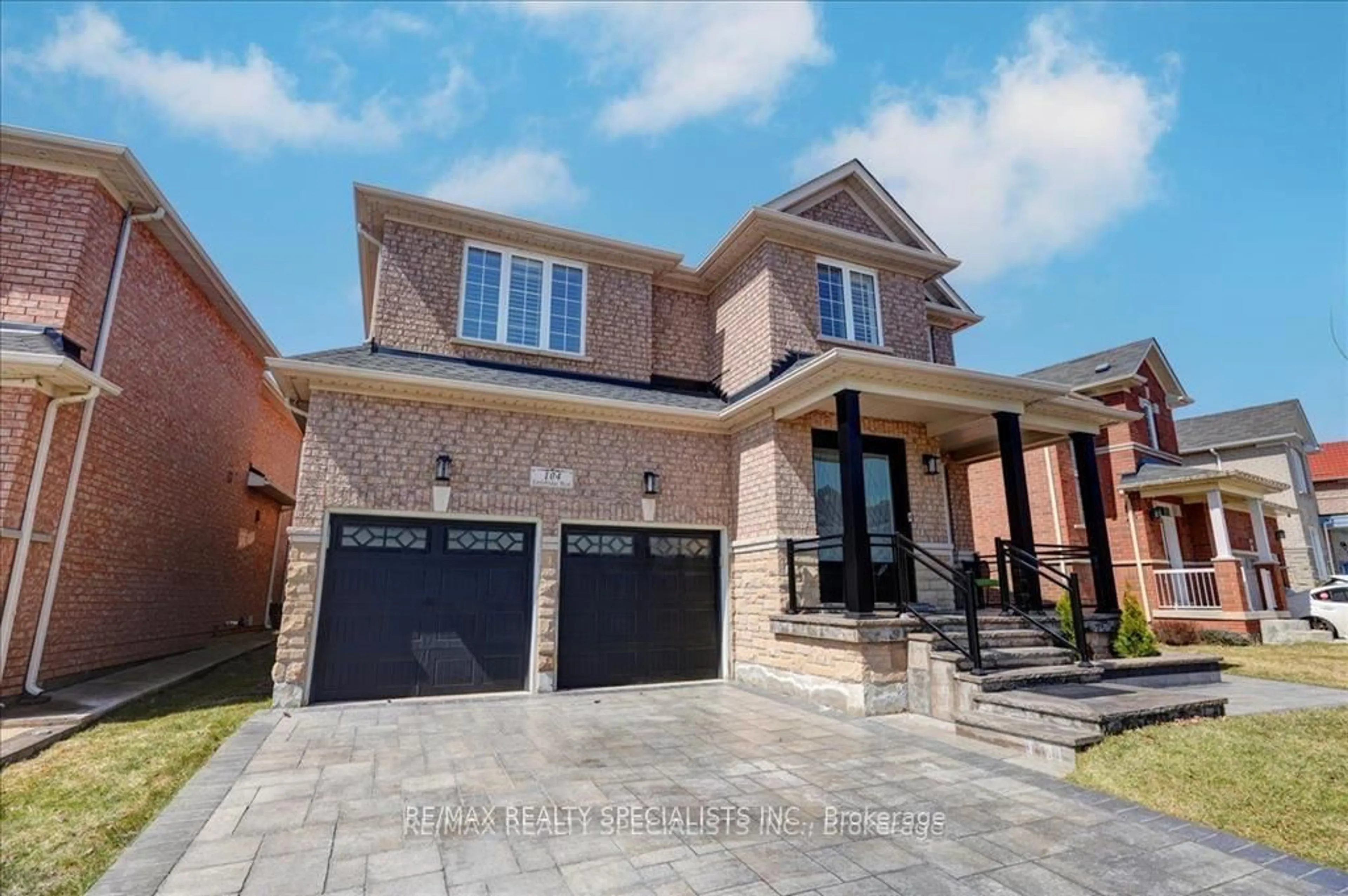 Home with brick exterior material, street for 104 Earlsbridge Blvd, Brampton Ontario L7A 3W7
