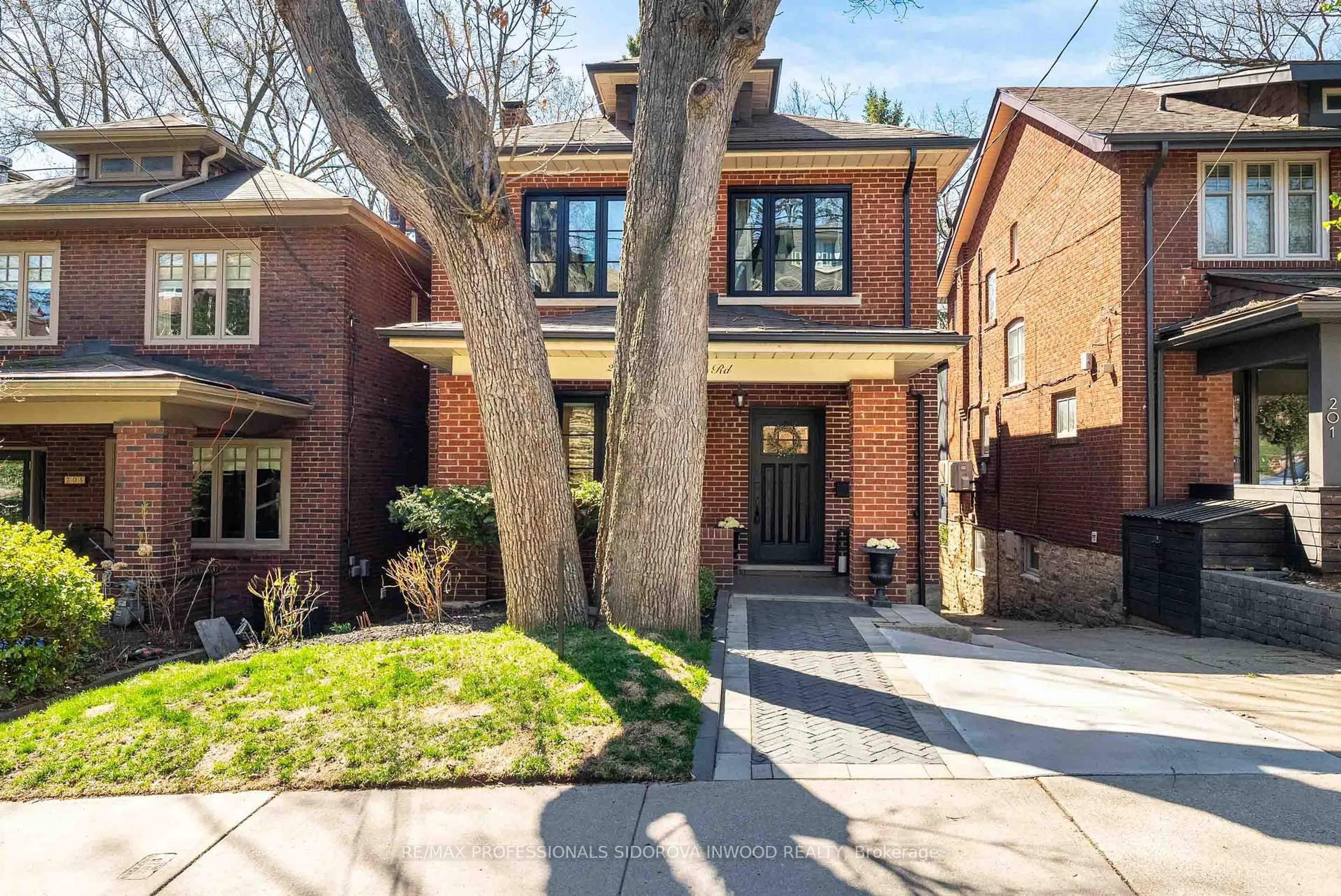 Home with brick exterior material, street for 203 Glendonwynne Rd, Toronto Ontario M6P 3E9