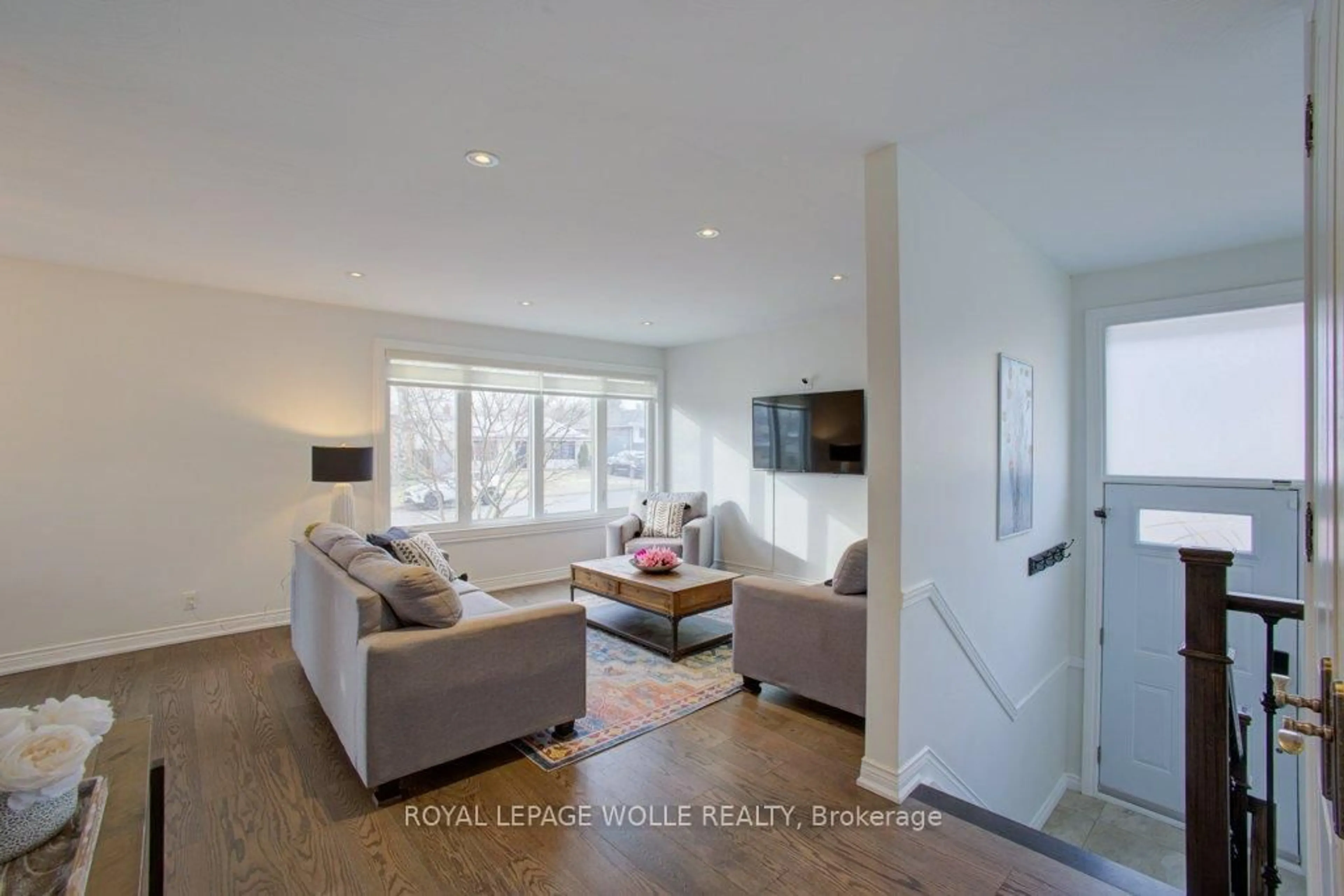 Living room with furniture, wood/laminate floor for 22 Brougham Cres, Toronto Ontario M9R 1J4
