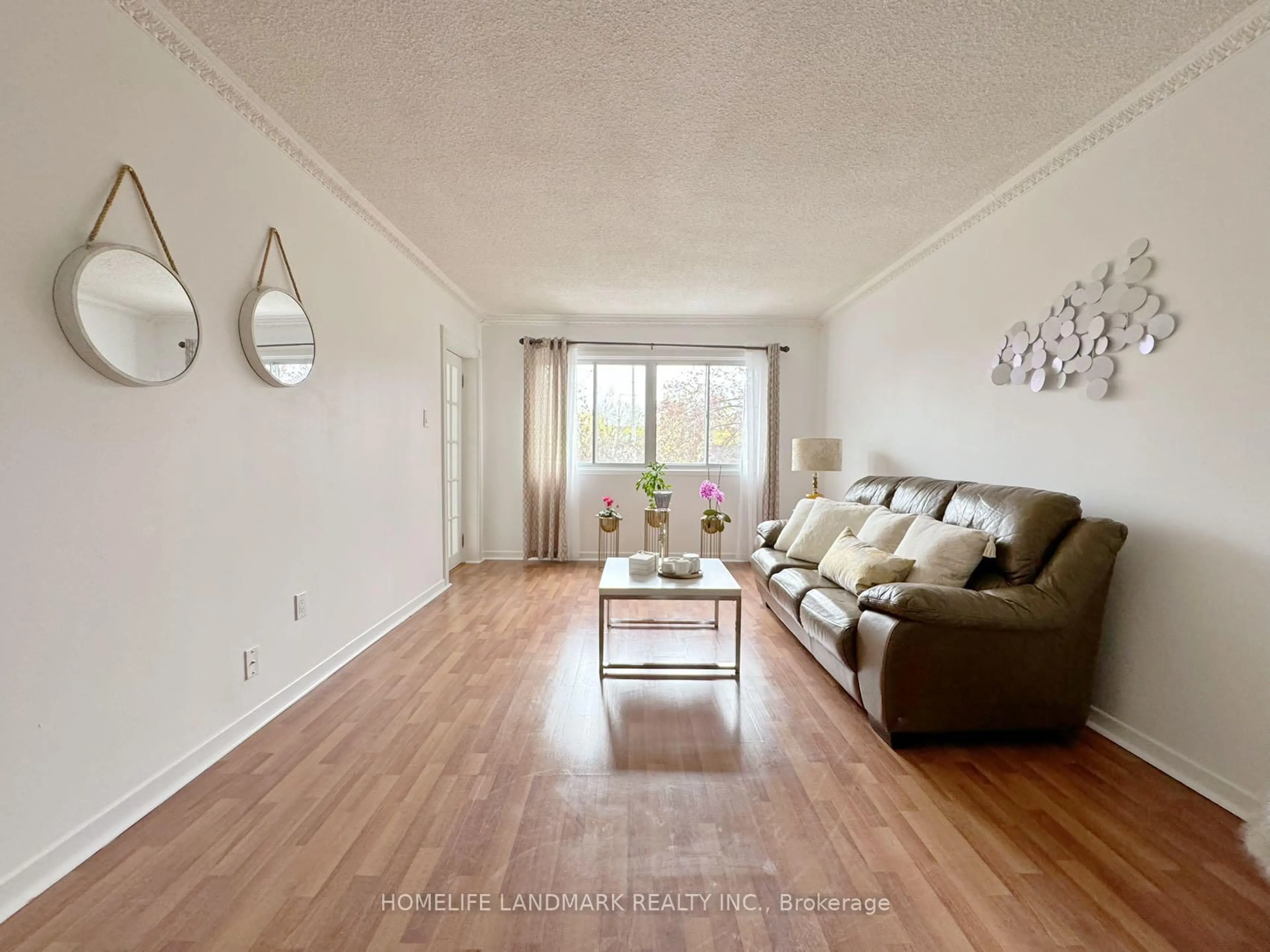 Living room with furniture, wood/laminate floor for 7030 Copenhagen Rd #30, Mississauga Ontario L5N 2P3