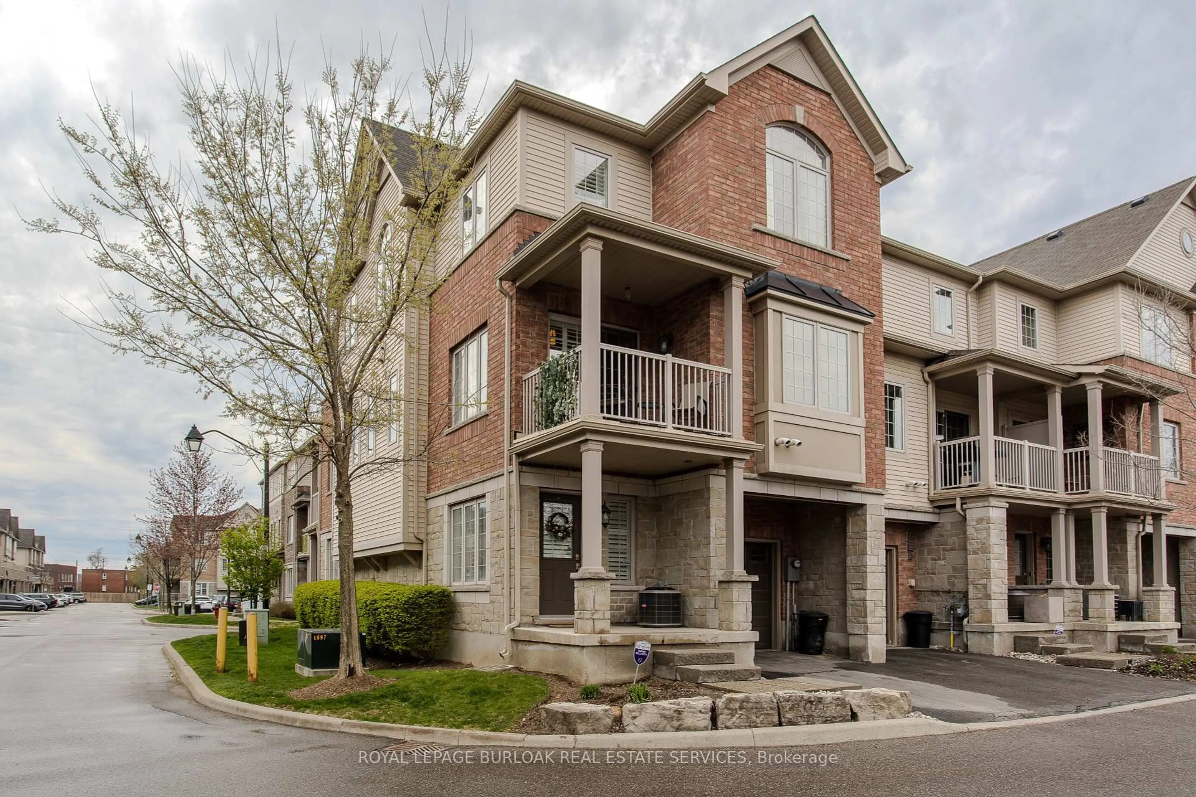 Home with brick exterior material, street for 1401 Plains Rd #112, Burlington Ontario L7R 0C2