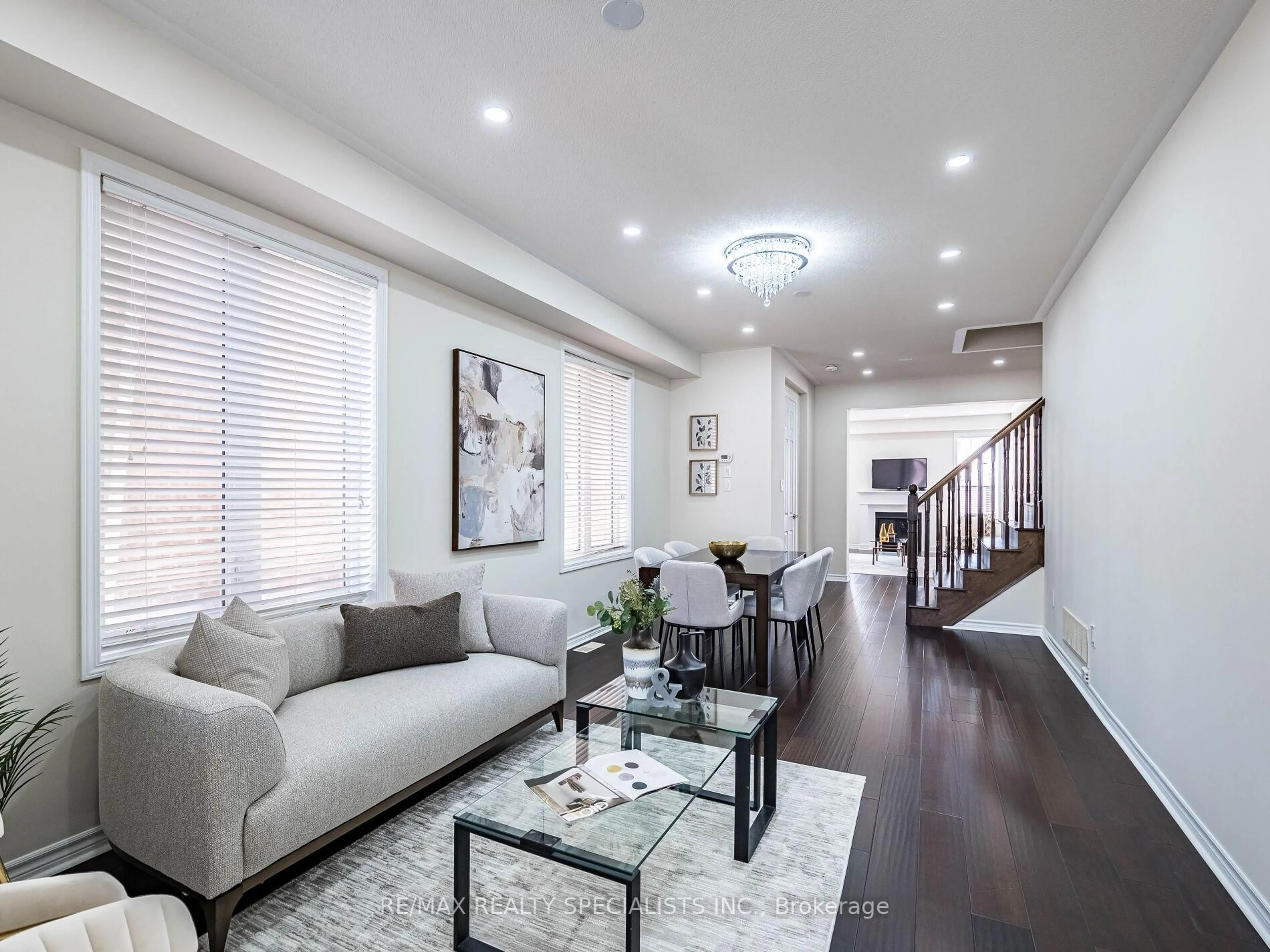 Living room with furniture, wood/laminate floor for 22 Callandar Rd, Brampton Ontario L7A 4V1