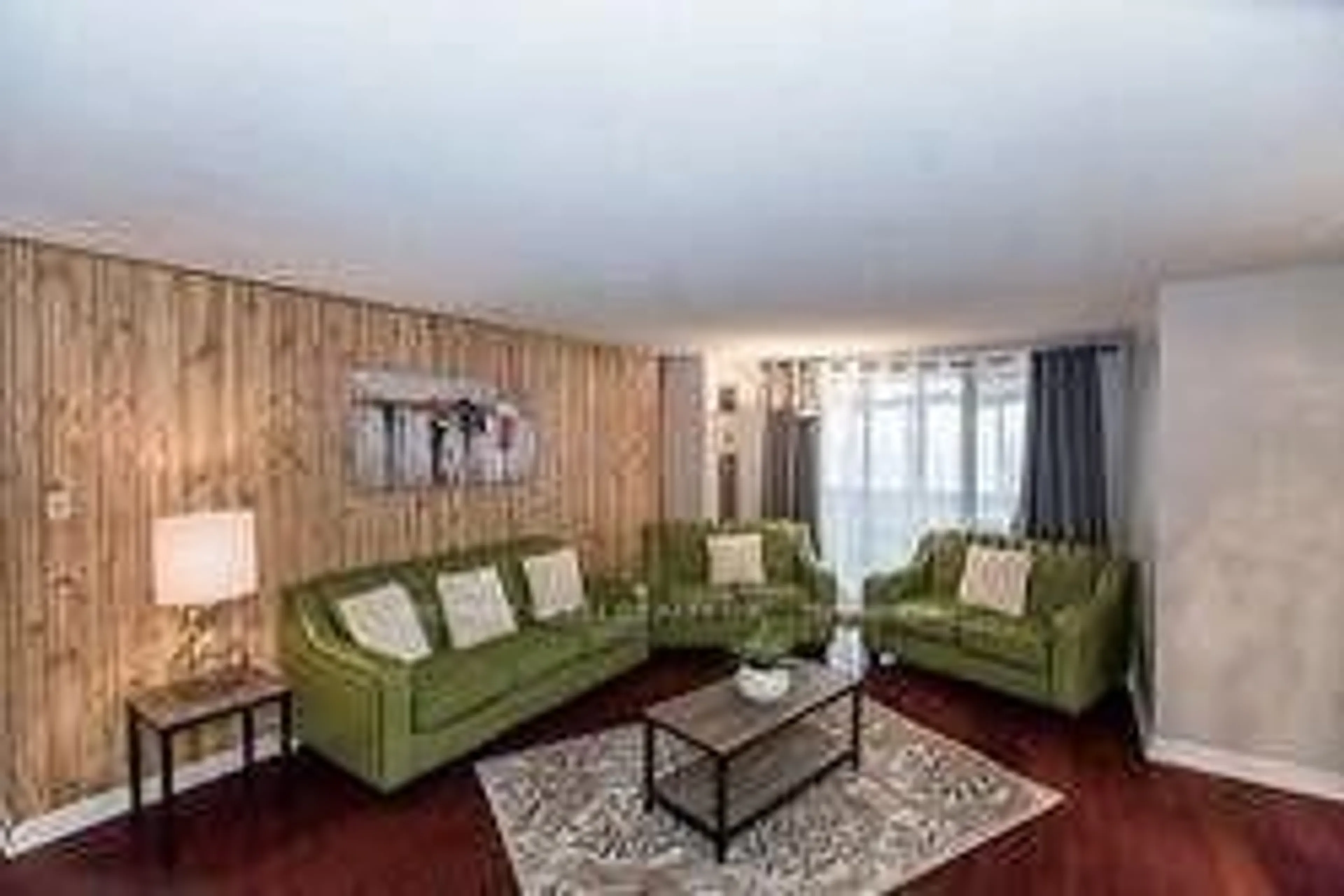 Living room with furniture, wood/laminate floor for 18 Knightsbridge Rd #1811, Brampton Ontario L6T 3X5