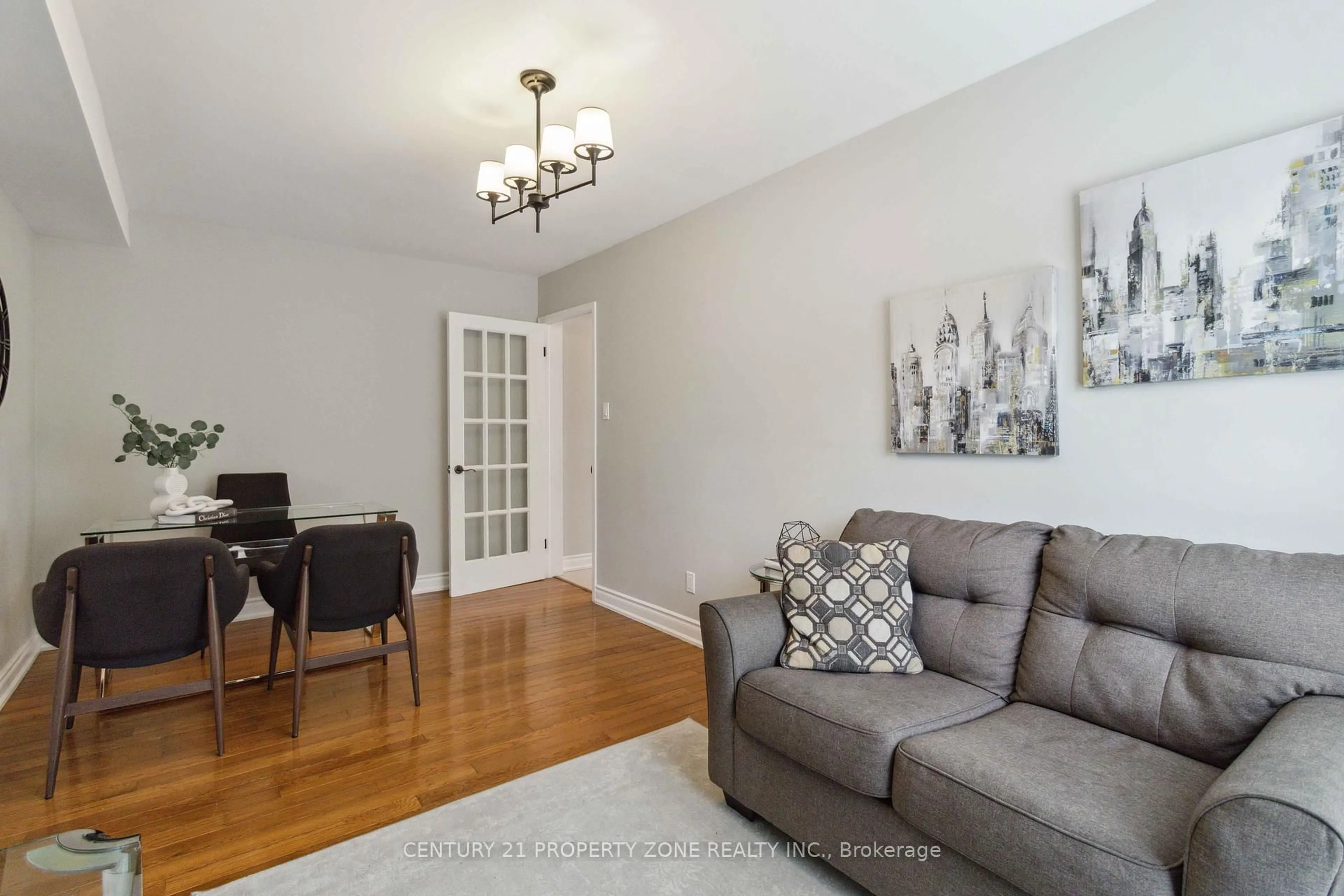 Living room with furniture, wood/laminate floor for 479 Bud Gregory Blvd, Mississauga Ontario L4Z 2K6