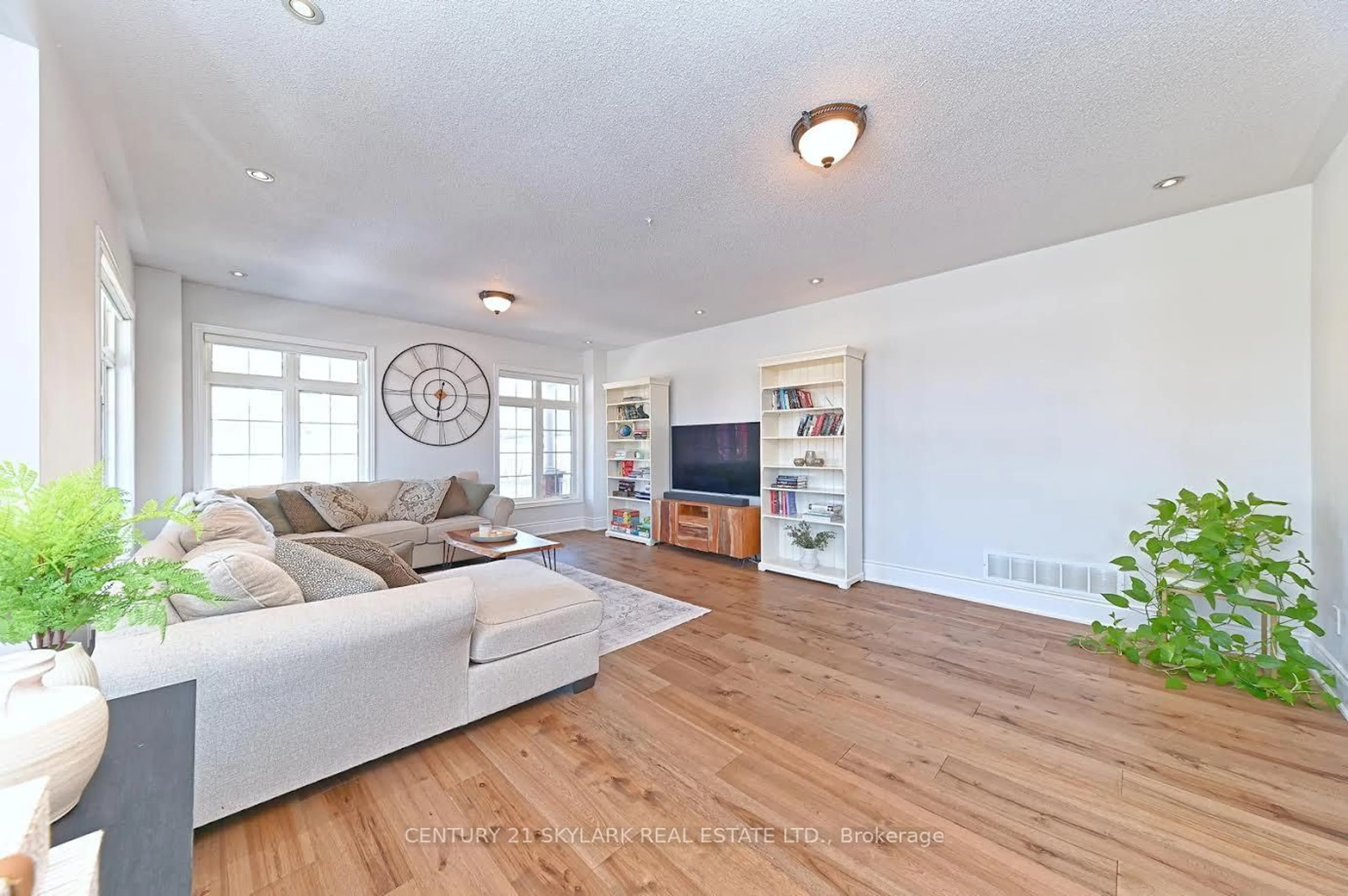 Living room with furniture, wood/laminate floor for 45 Kidbrook Rd, Brampton Ontario L6P 2A6