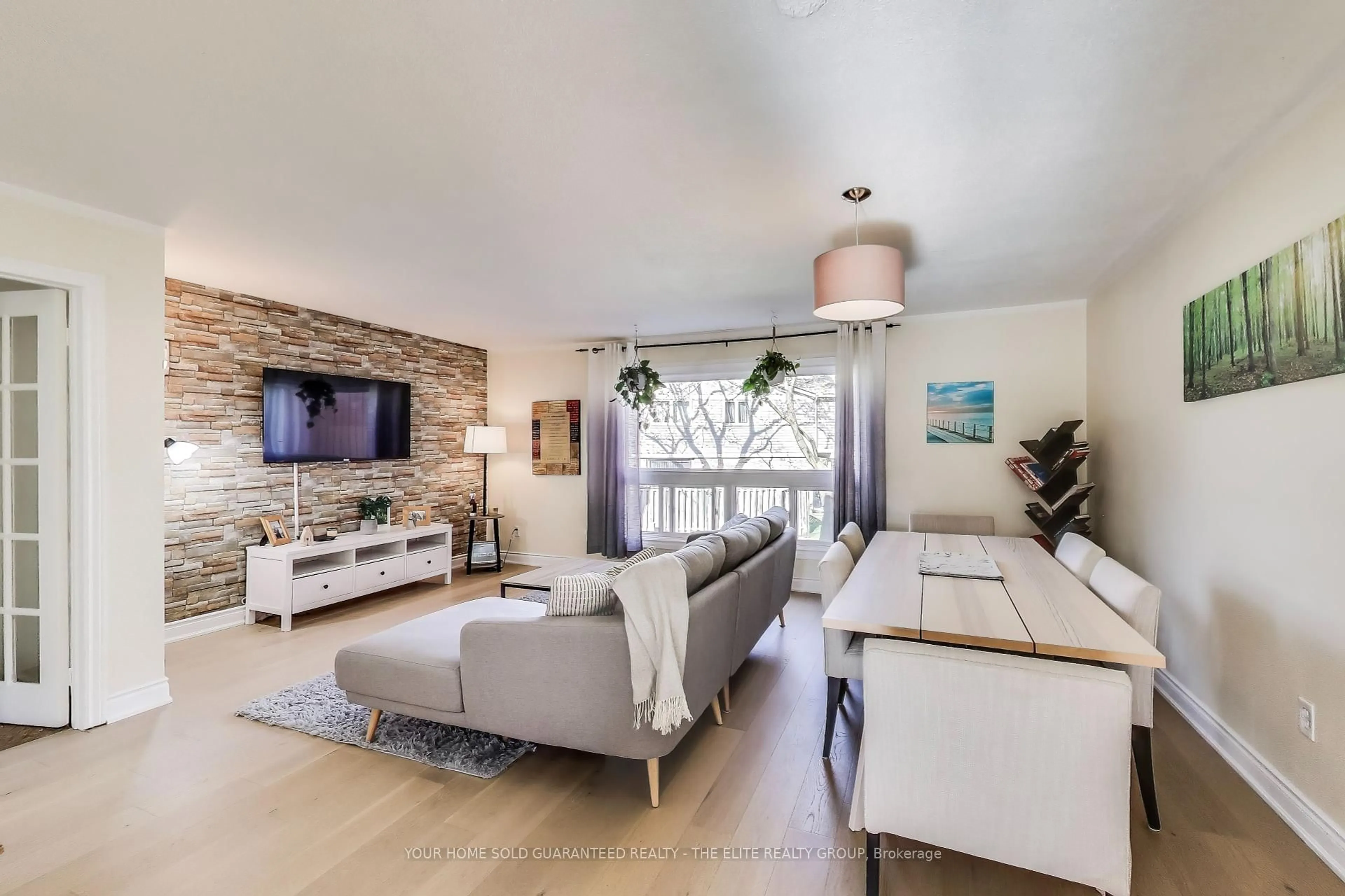 Living room with furniture, unknown for 98 Falconer Dr #72, Mississauga Ontario L5N 1Y2