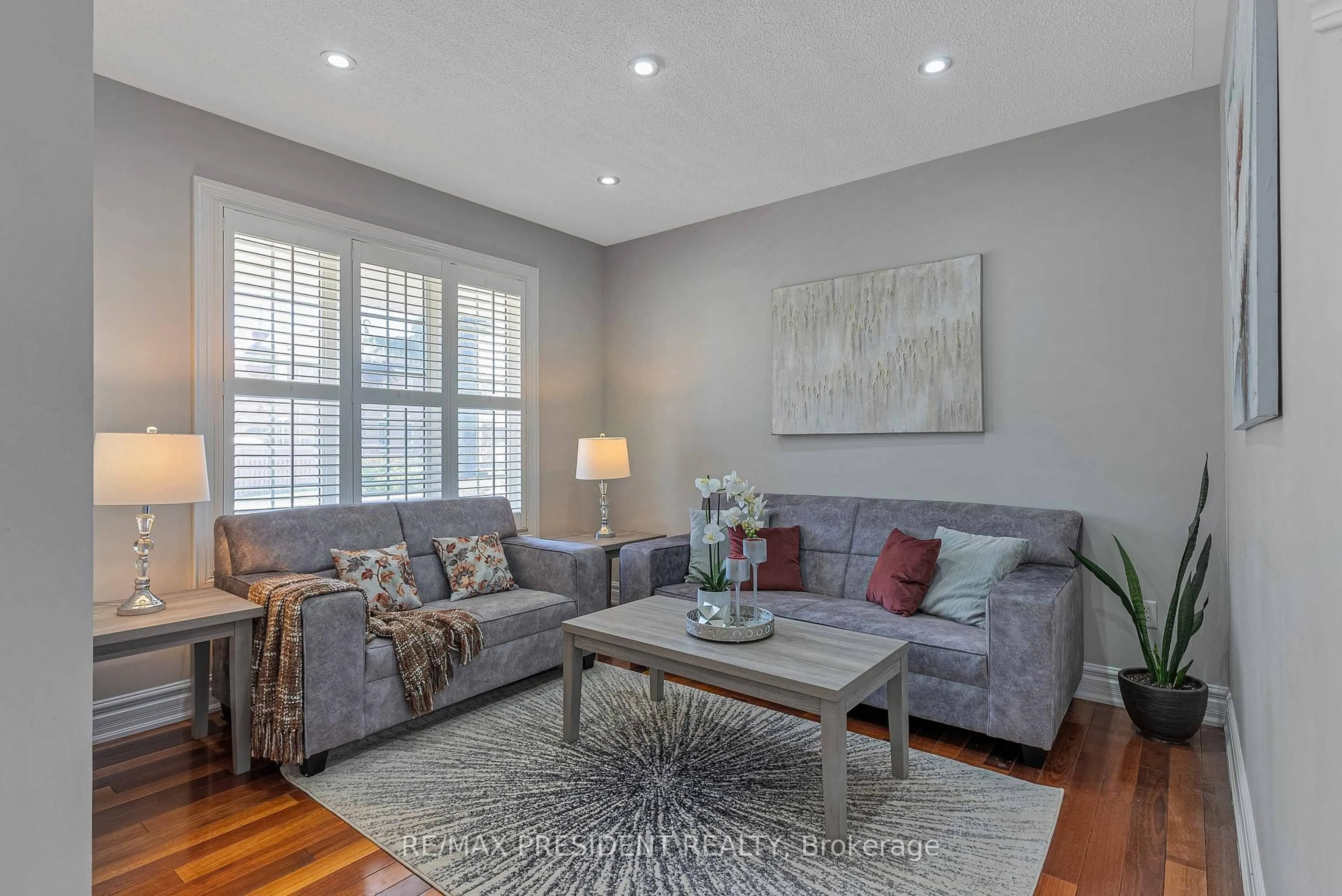 Living room with furniture, wood/laminate floor for 151 Herdwick St, Brampton Ontario L6S 0A7