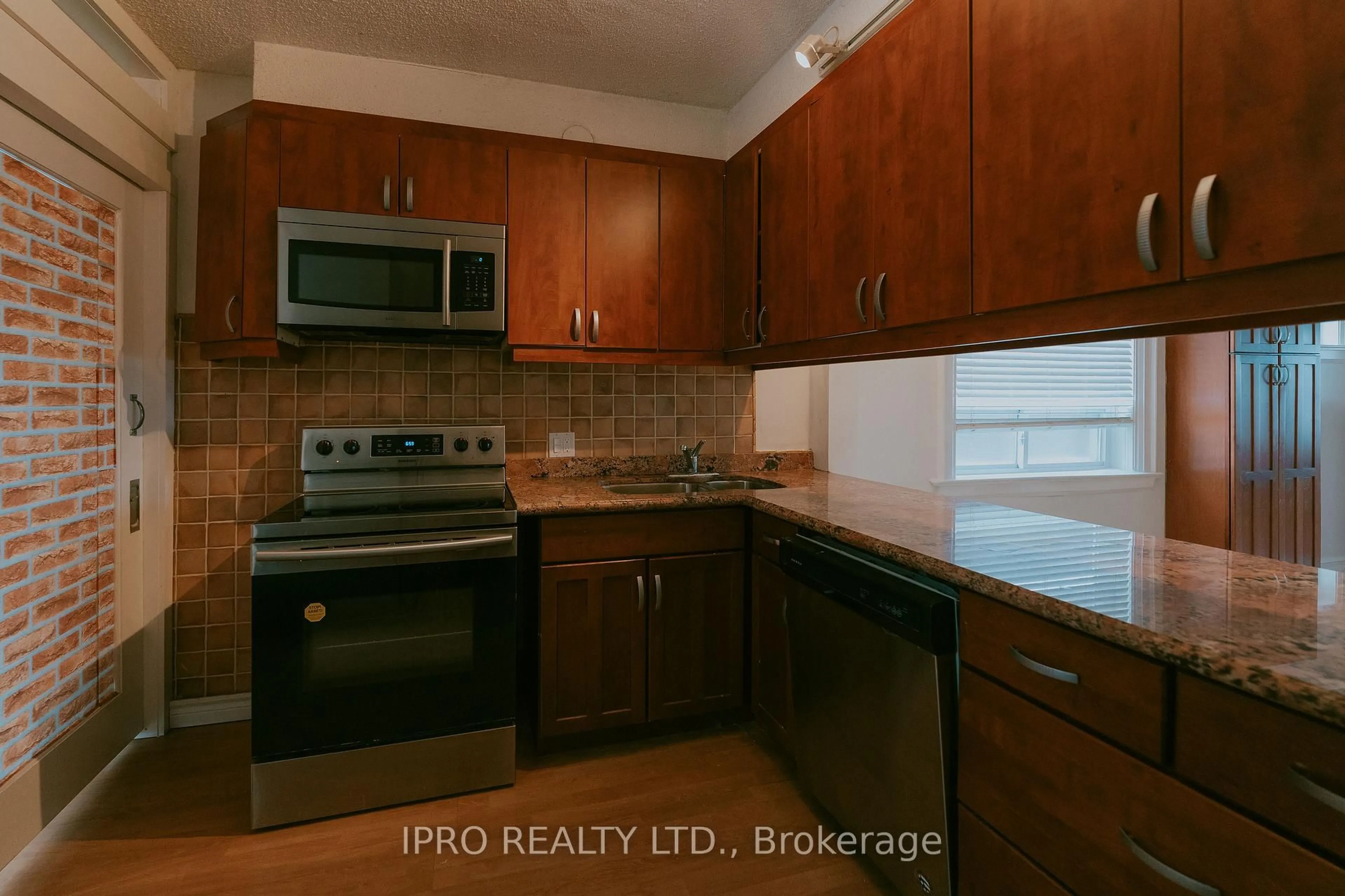 Standard kitchen, wood/laminate floor for 183 Livingstone Ave, Toronto Ontario M6E 2L9