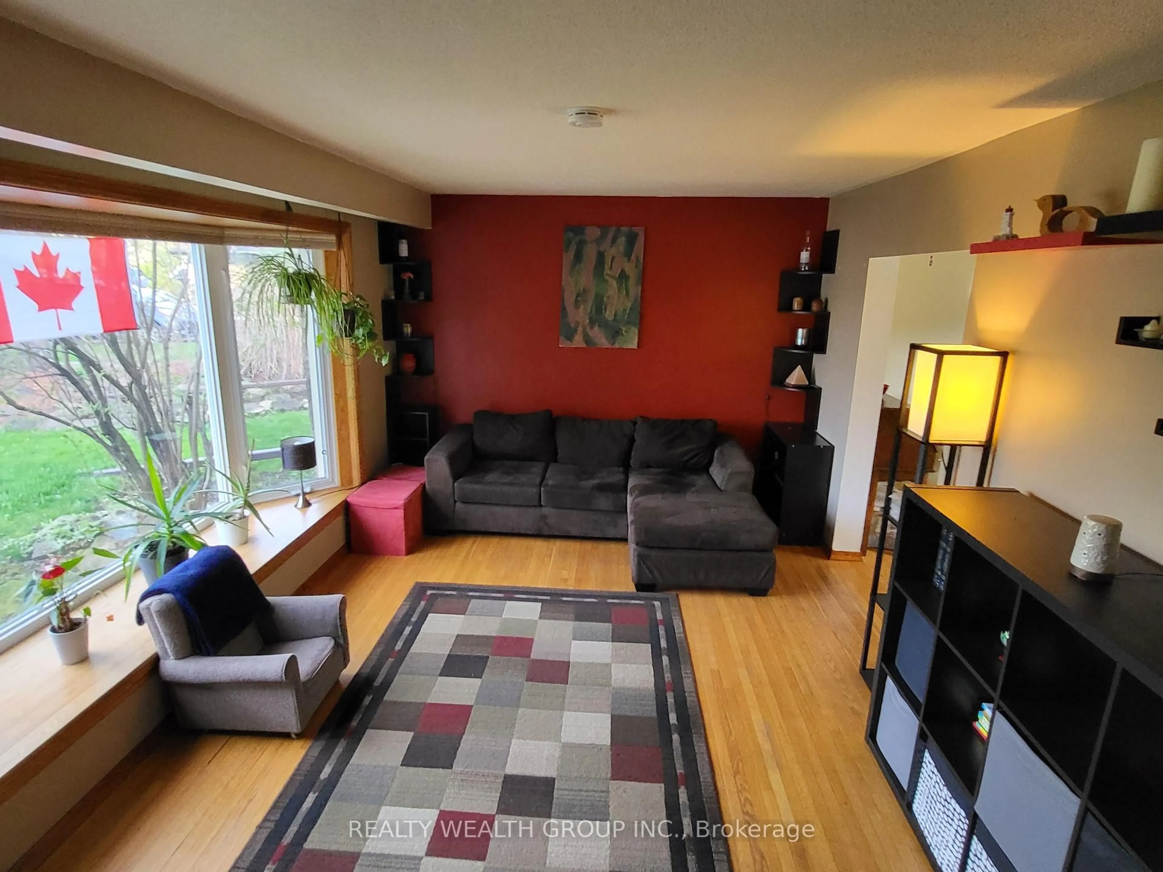Living room with furniture, wood/laminate floor for 30 Allendale Rd, Brampton Ontario L6W 2Y8