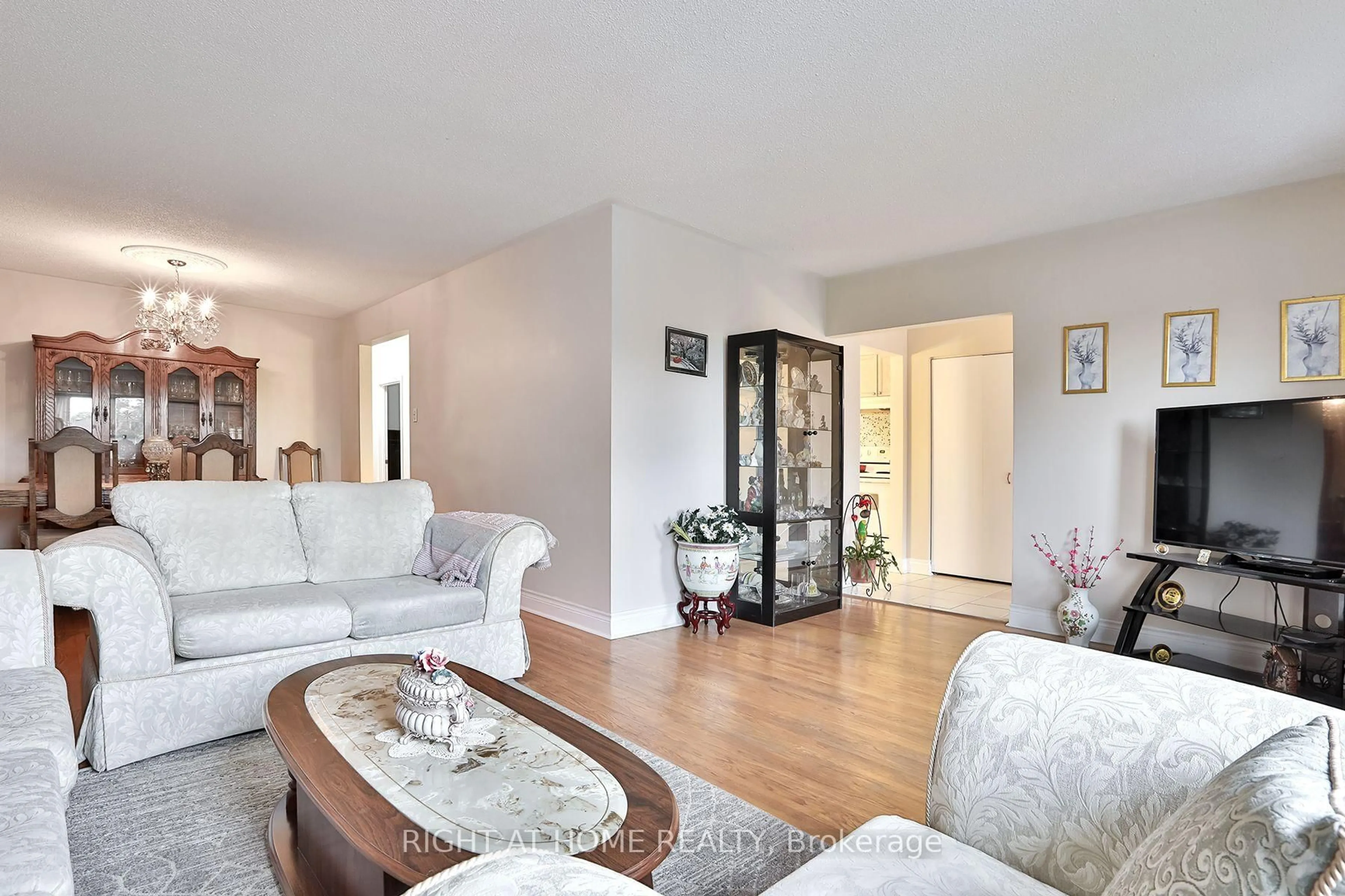 Living room with furniture, wood/laminate floor for 15 Tinton Cres, Toronto Ontario M9V 2H9