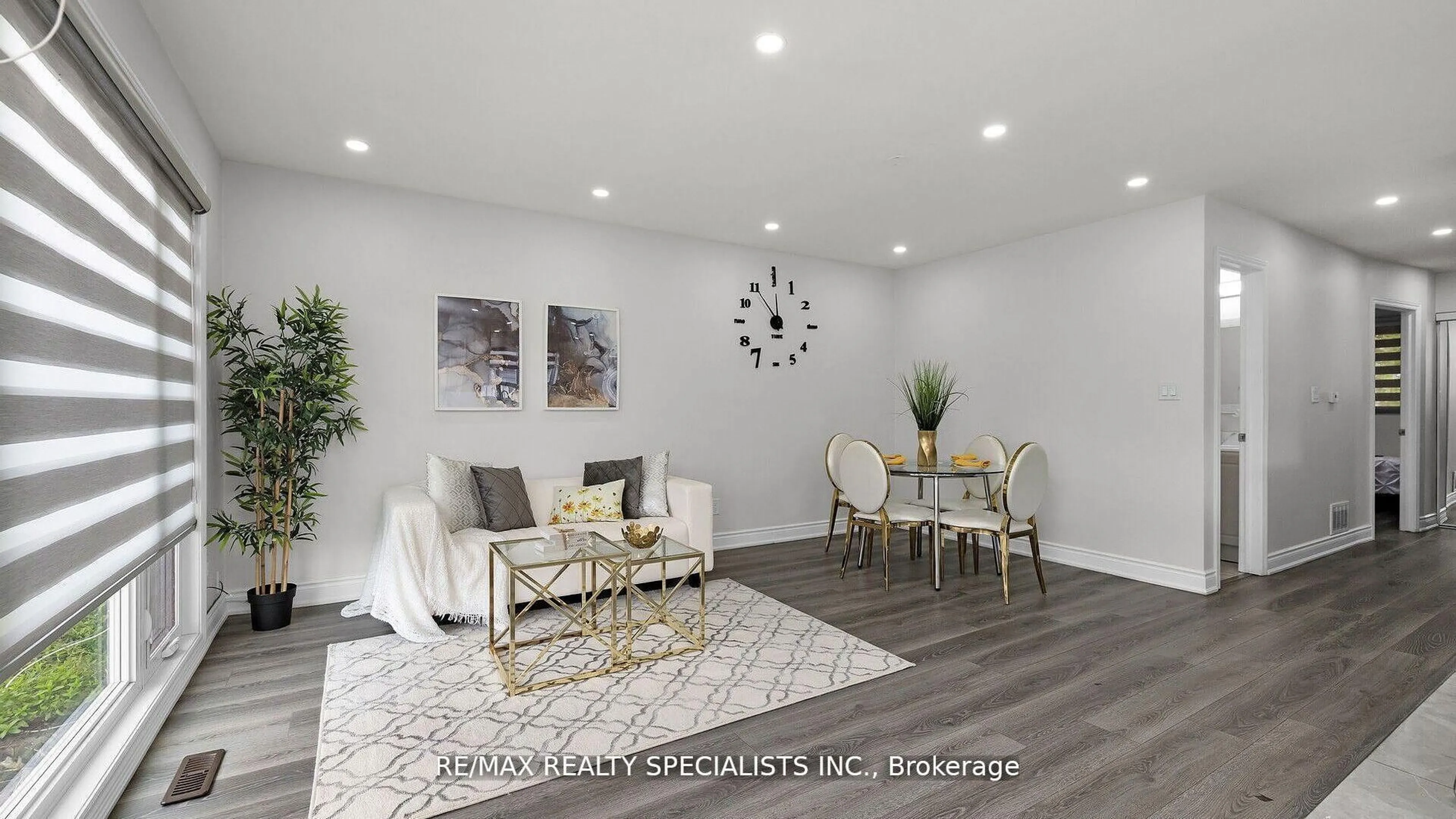 Living room with furniture, wood/laminate floor for 16 Drake Blvd, Brampton Ontario L6T 3K9