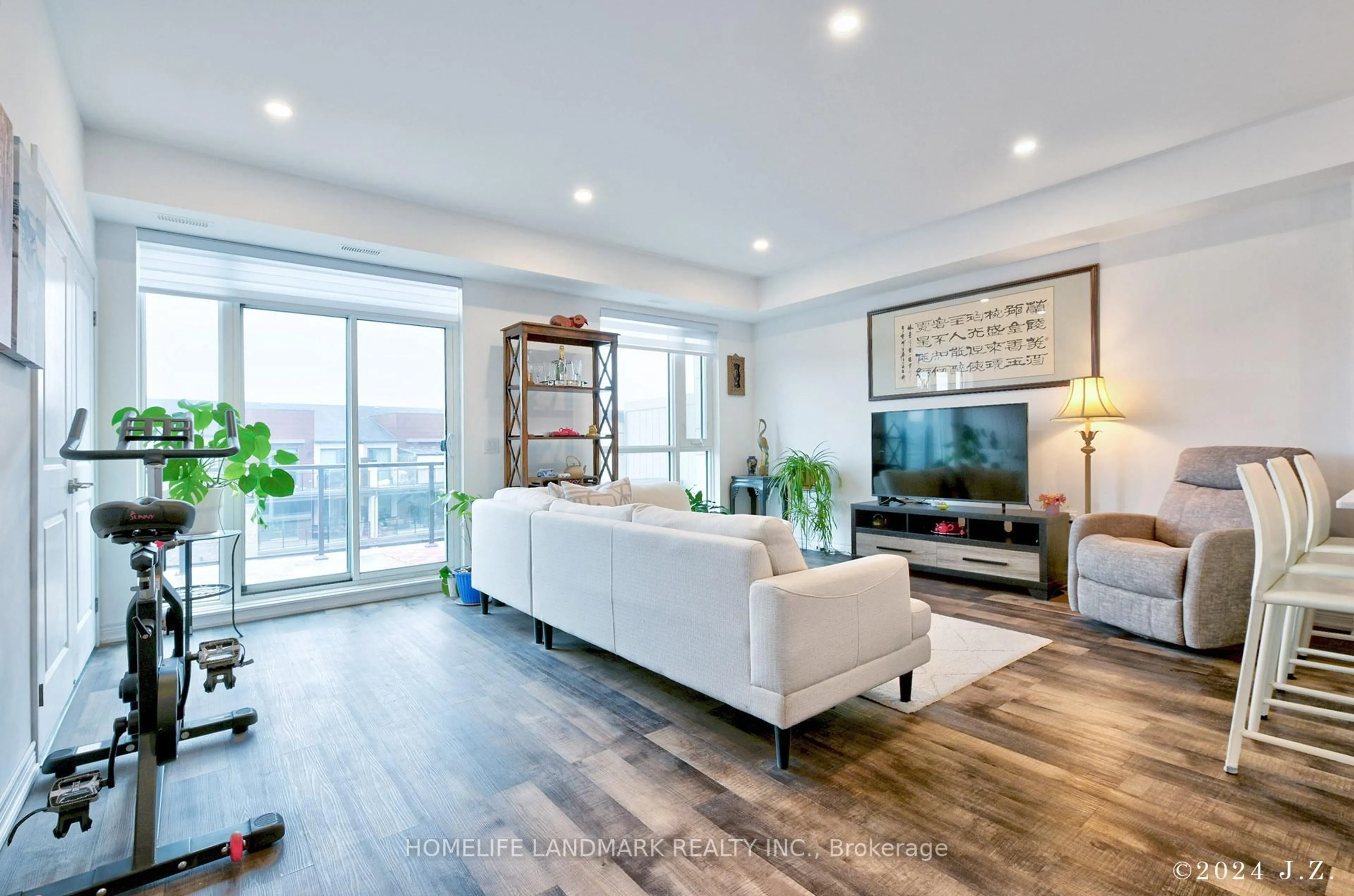 Living room with furniture, wood/laminate floor for 2370 Khalsa Gate #308, Oakville Ontario L6M 4J2