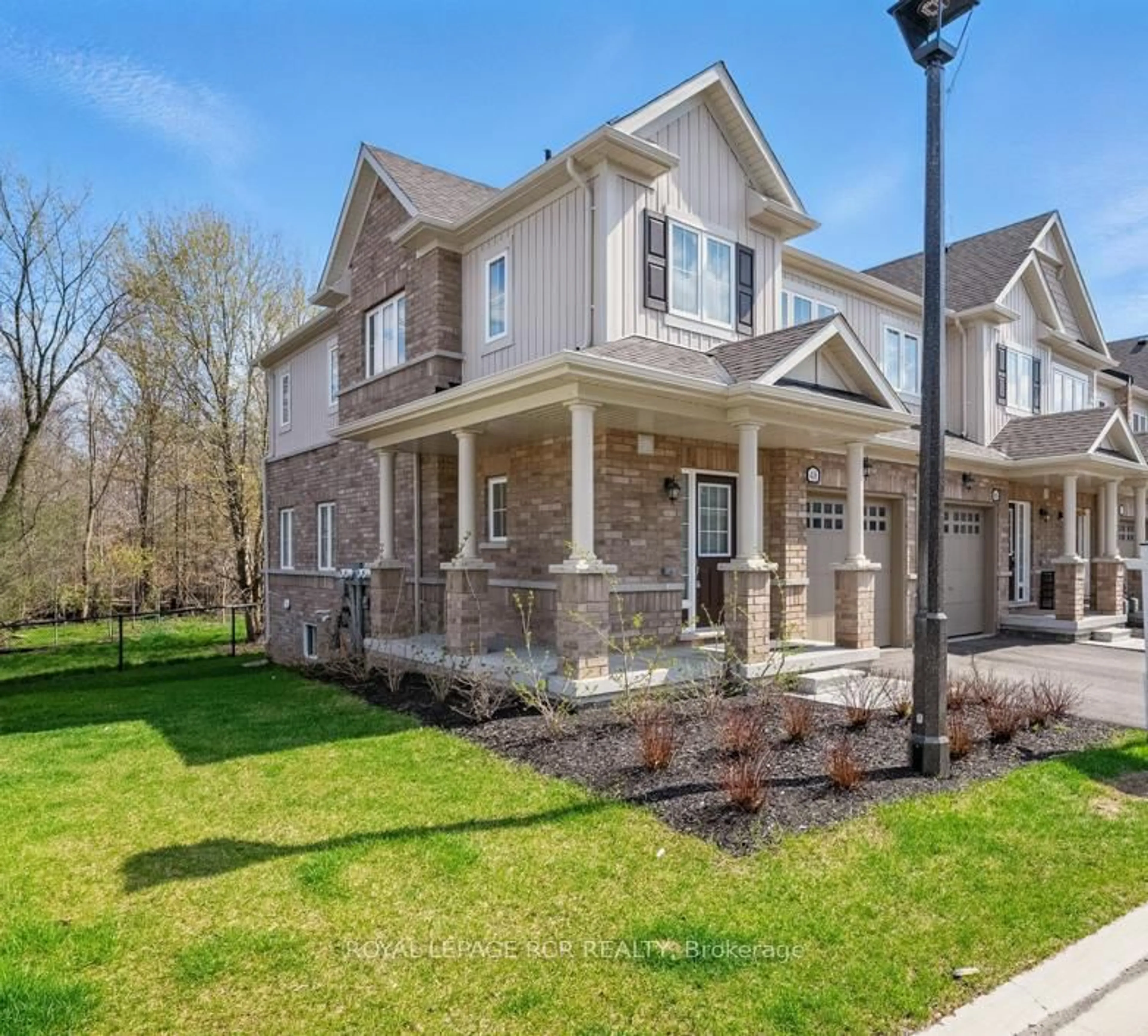 Home with brick exterior material, street for 48 Brixham Lane, Brampton Ontario L7A 5K2