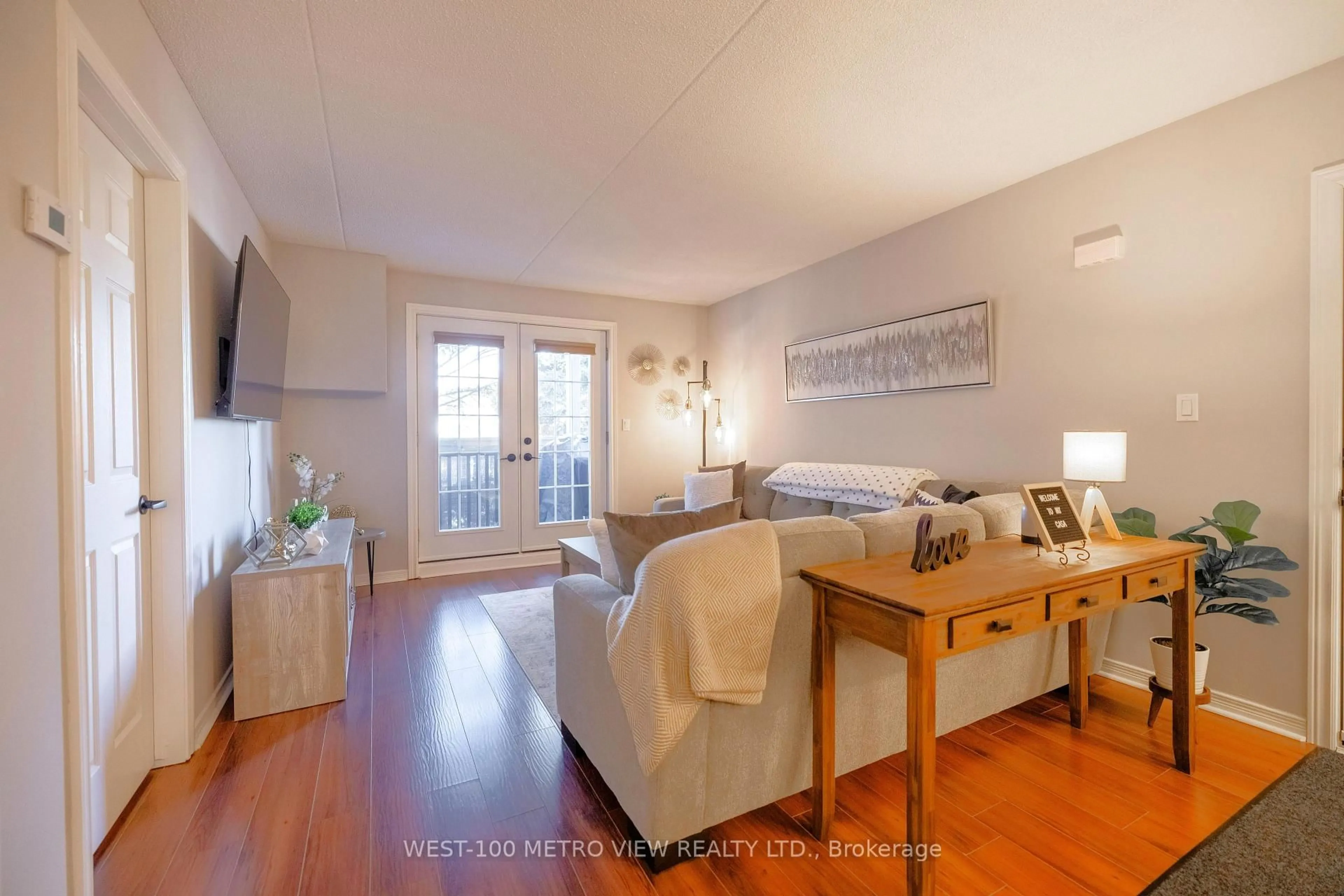 Living room with furniture, wood/laminate floor for 2040 Cleaver Ave #209, Burlington Ontario L7M 4C4