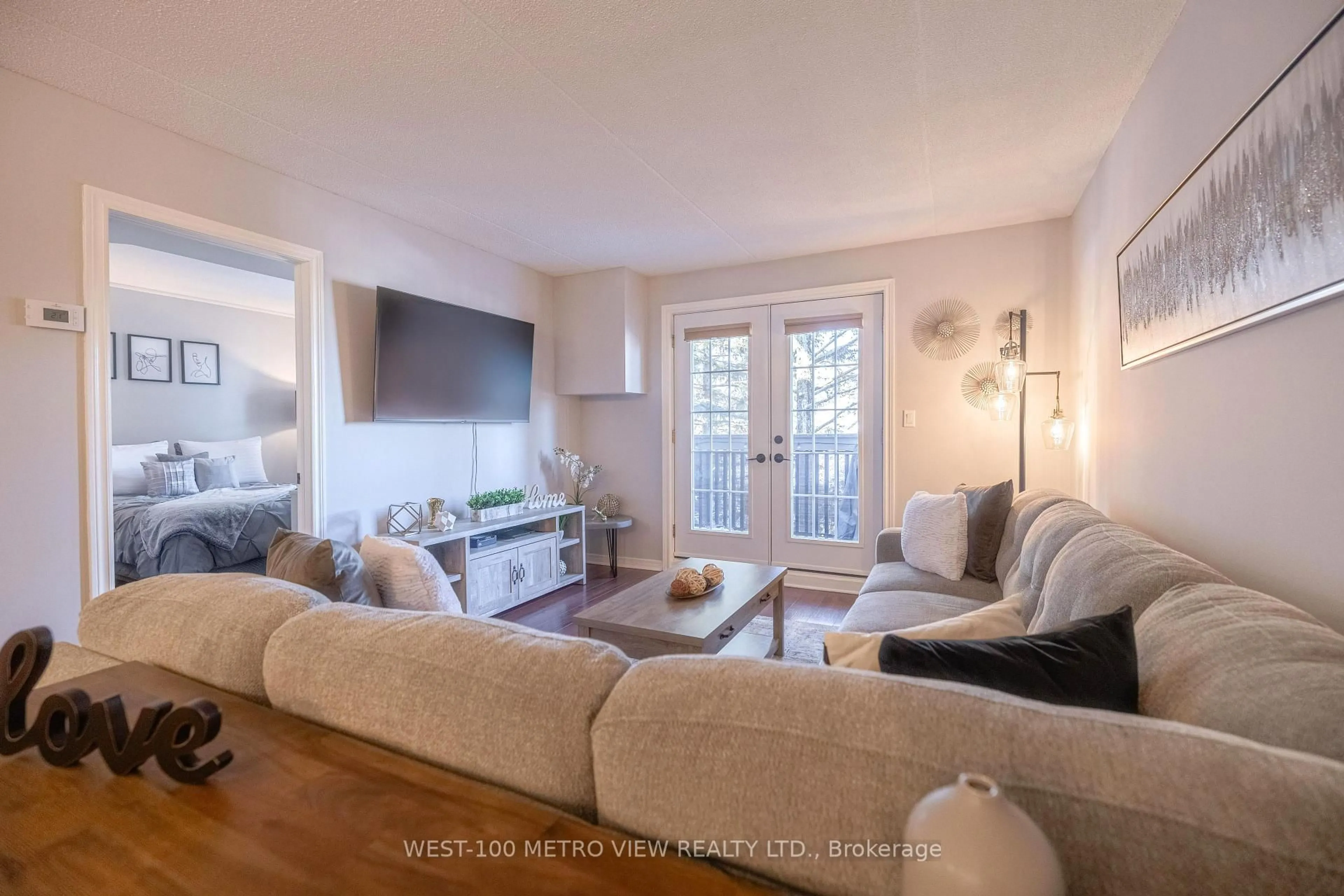 Living room with furniture, wood/laminate floor for 2040 Cleaver Ave #209, Burlington Ontario L7M 4C4