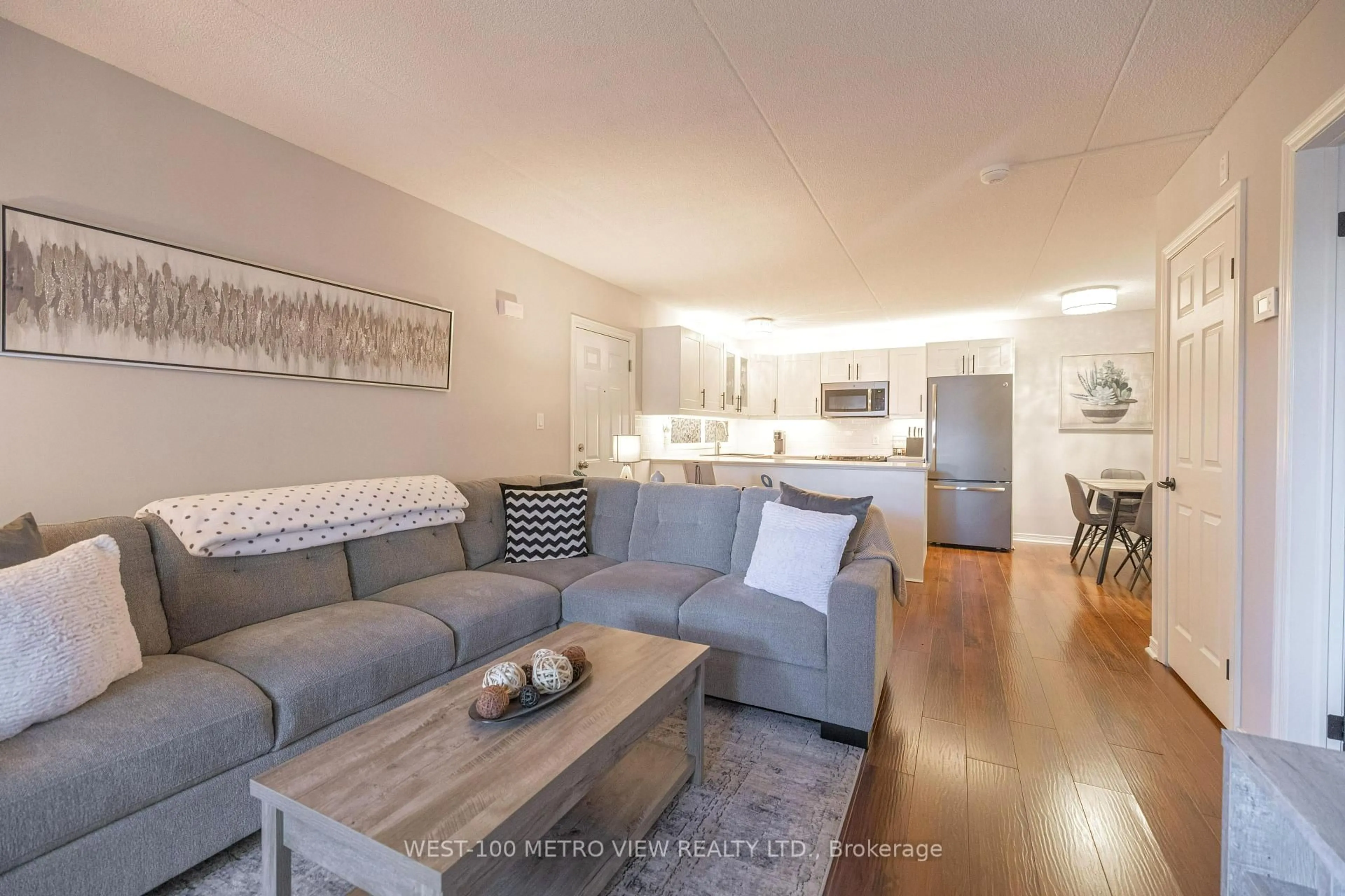 Living room with furniture, wood/laminate floor for 2040 Cleaver Ave #209, Burlington Ontario L7M 4C4
