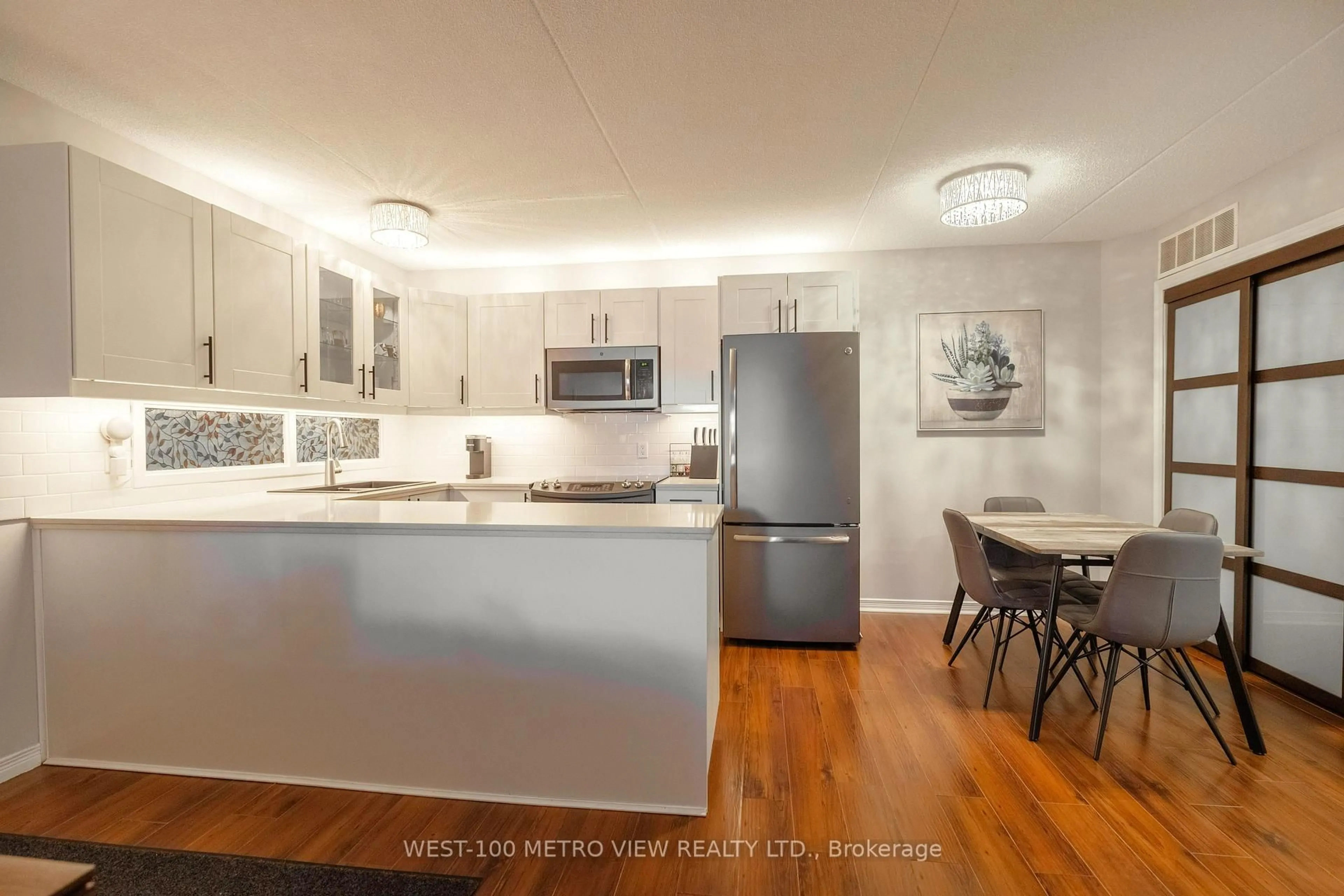 Open concept kitchen, wood/laminate floor for 2040 Cleaver Ave #209, Burlington Ontario L7M 4C4