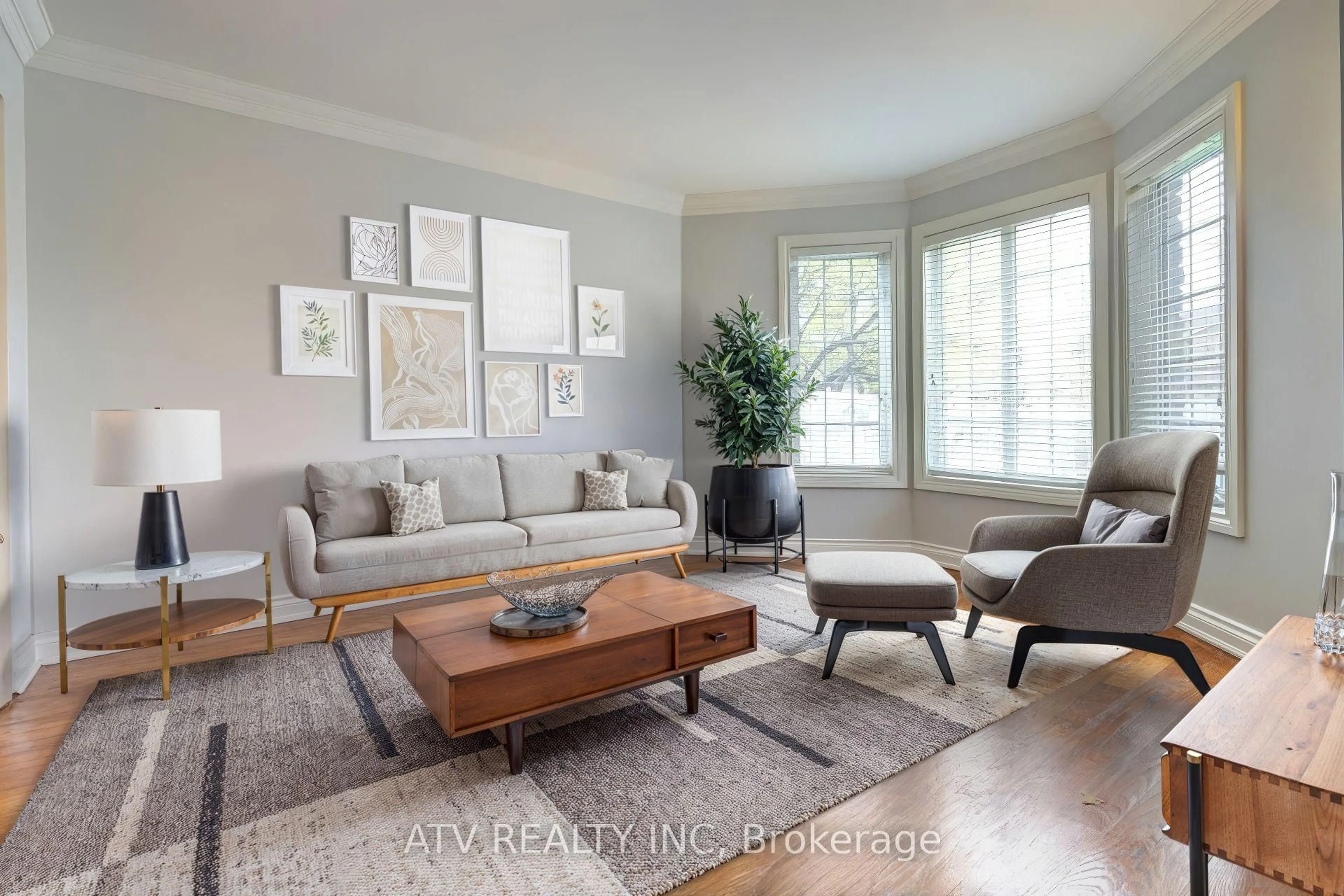 Living room with furniture, wood/laminate floor for 31 Shaver Ave, Toronto Ontario M9B 3T2