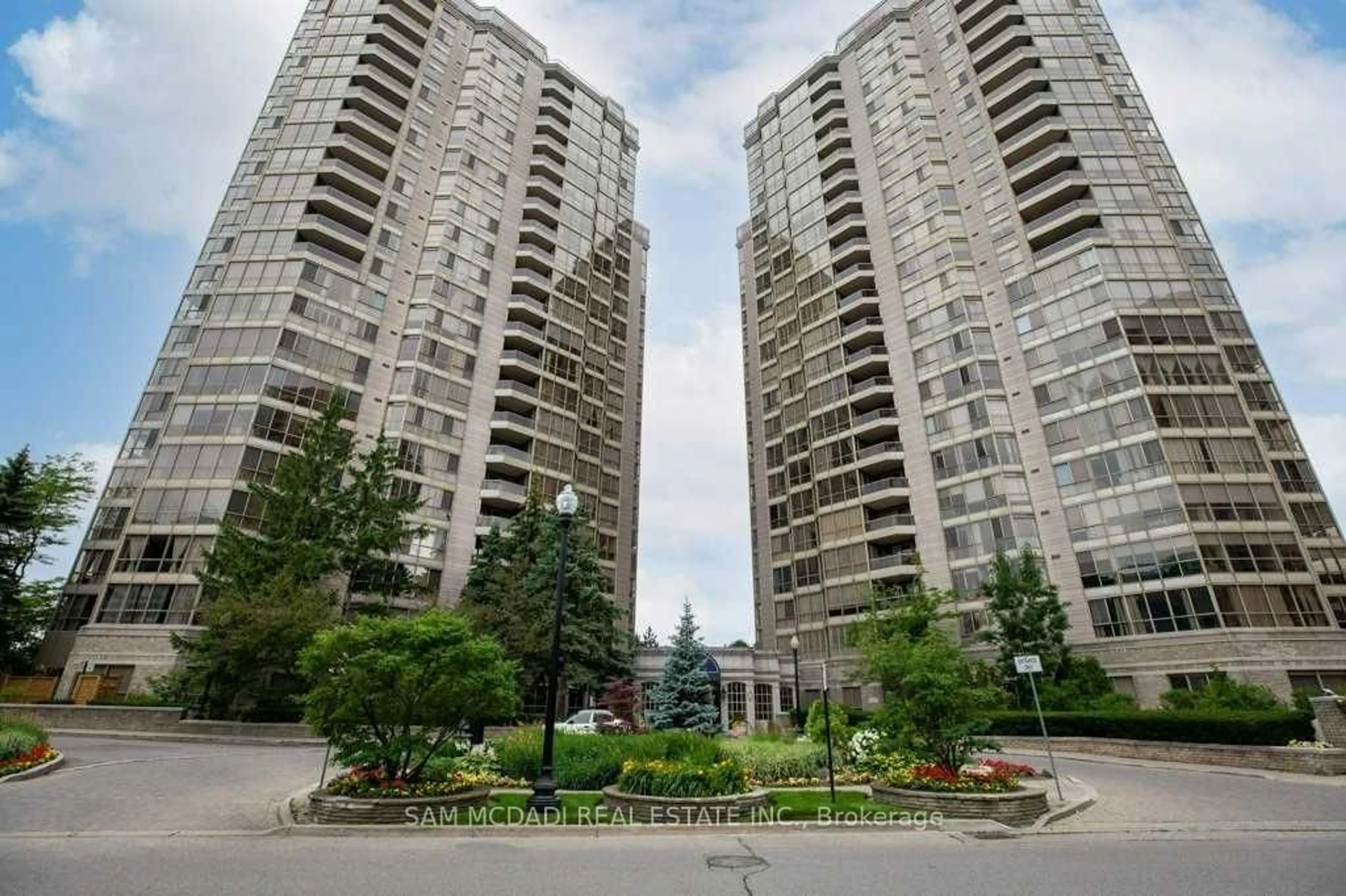 Patio, city buildings view from balcony for 55 Kingsbridge Garden Circ #1411, Mississauga Ontario L5R 1Y1