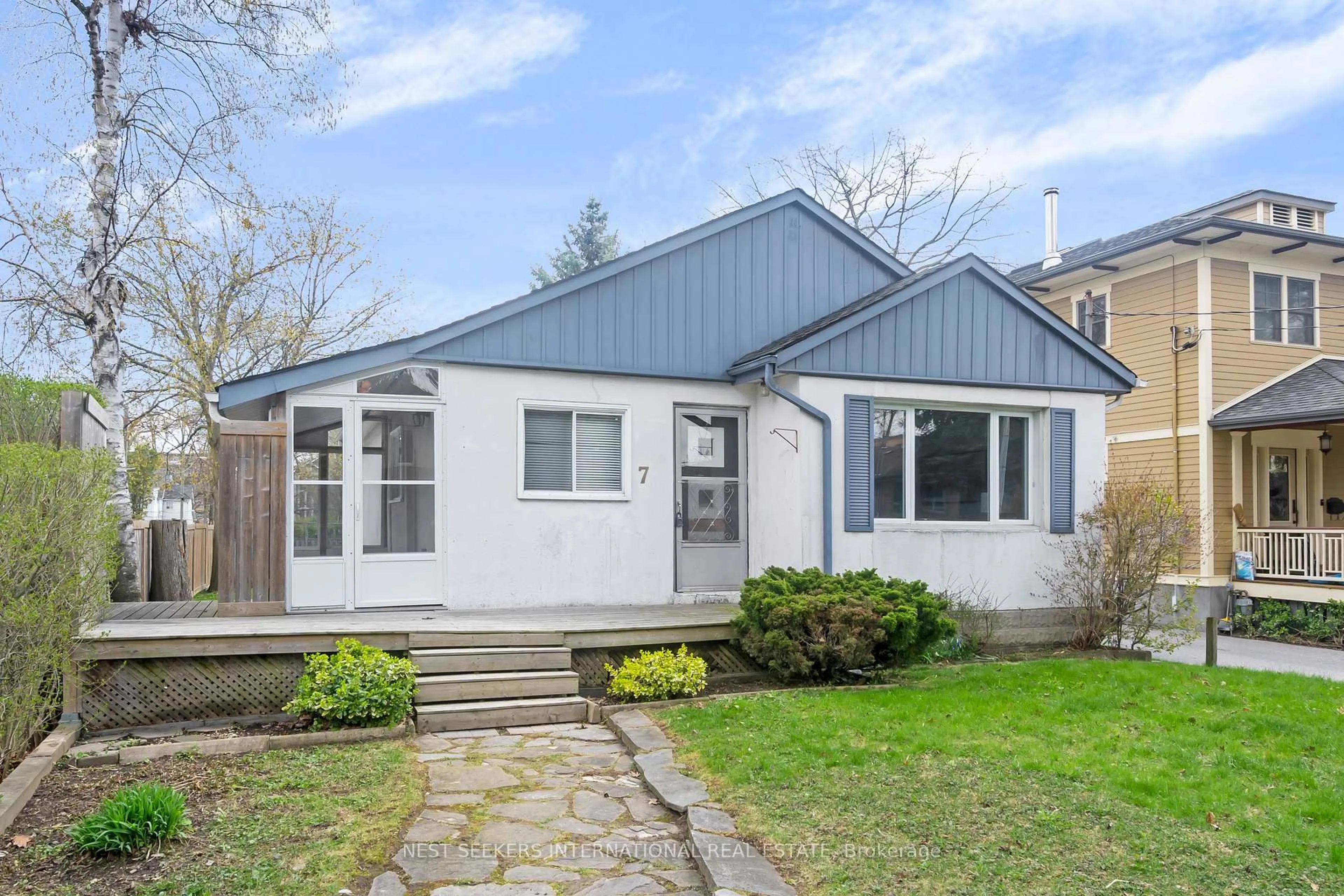 Home with vinyl exterior material, street for 7 Thirty Fifth St, Toronto Ontario M8W 3J6