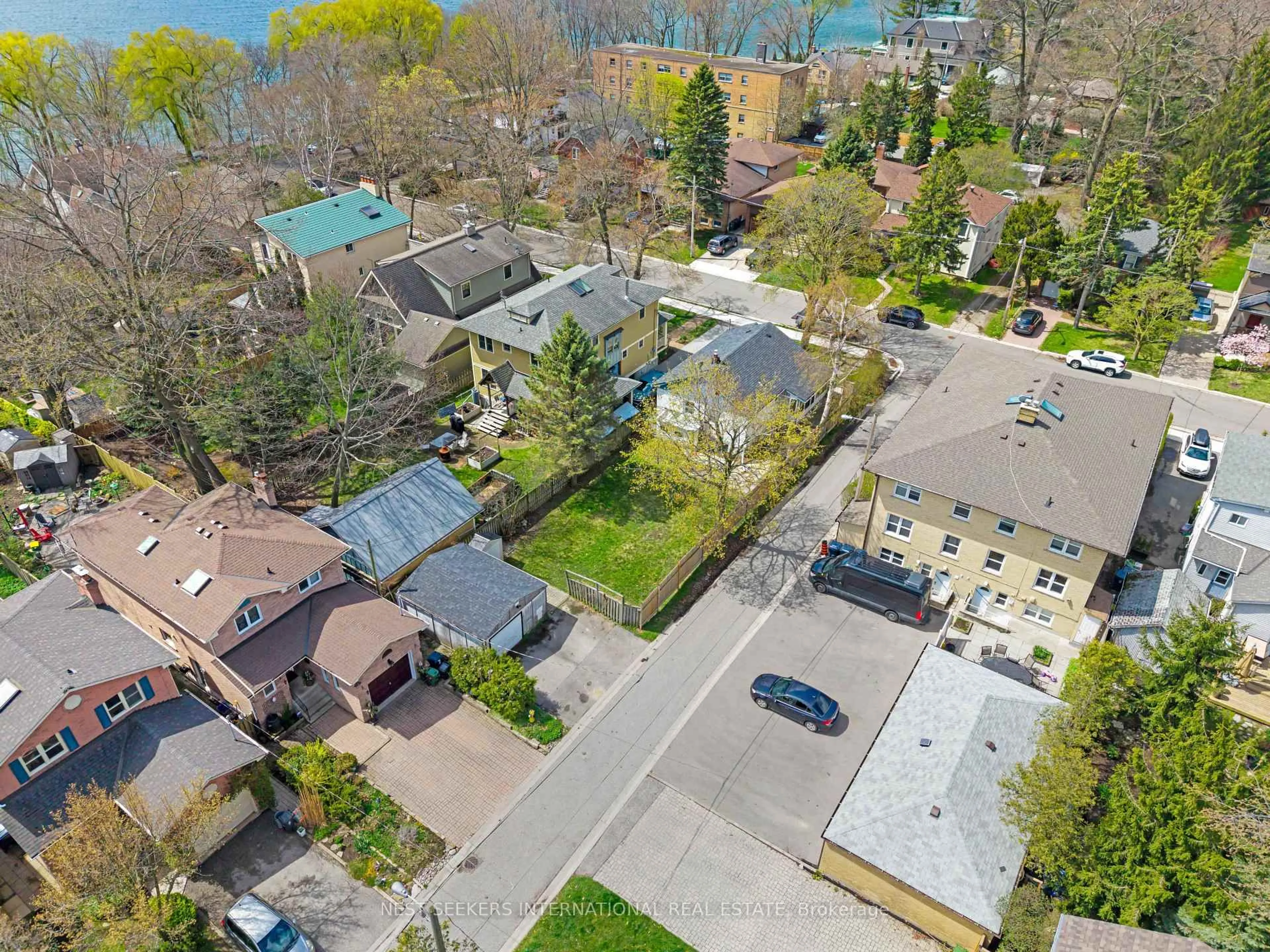 A pic from outside/outdoor area/front of a property/back of a property/a pic from drone, street for 7 Thirty Fifth St, Toronto Ontario M8W 3J6