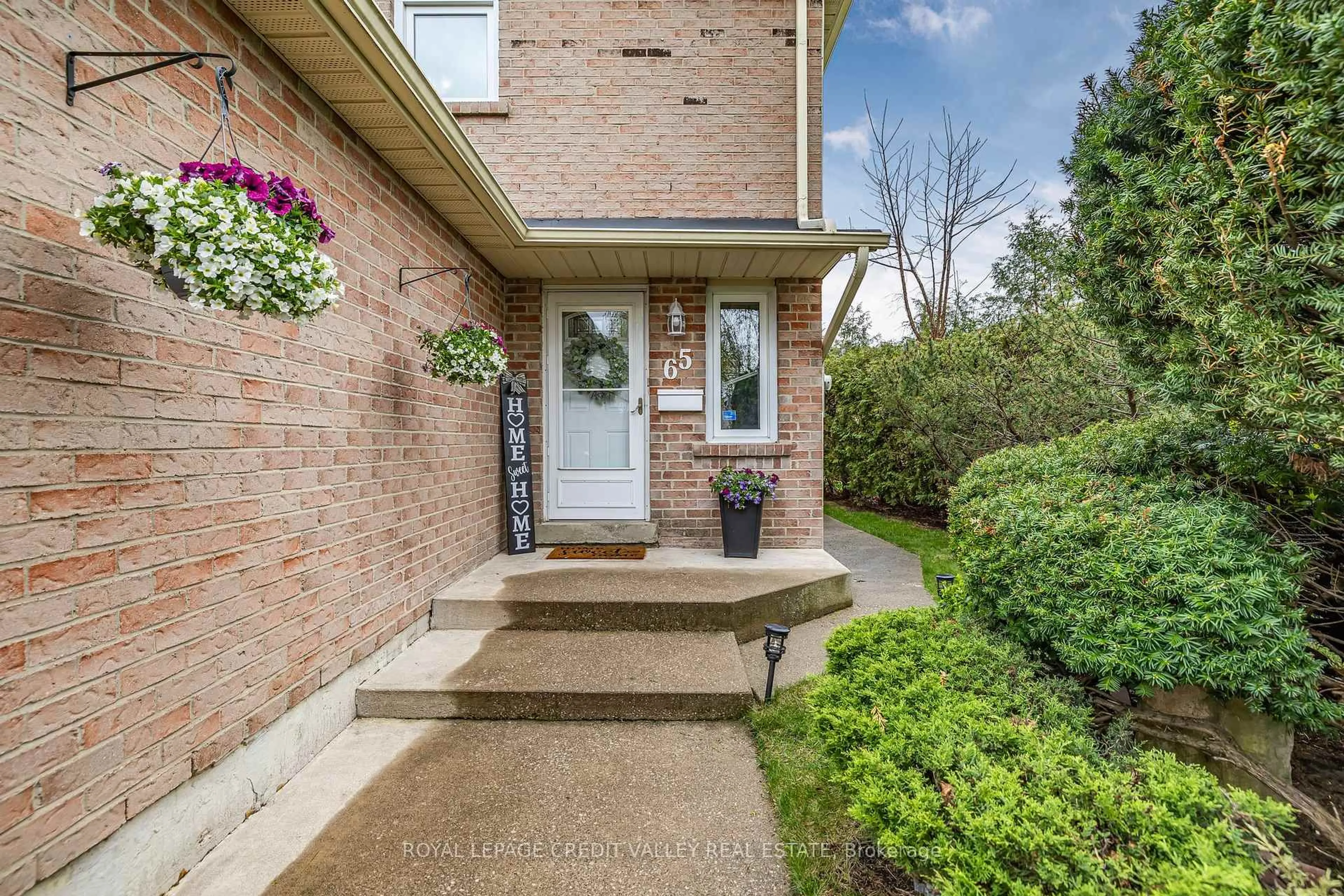 Home with brick exterior material, street for 65 Martindale Cres, Brampton Ontario L6X 2V7