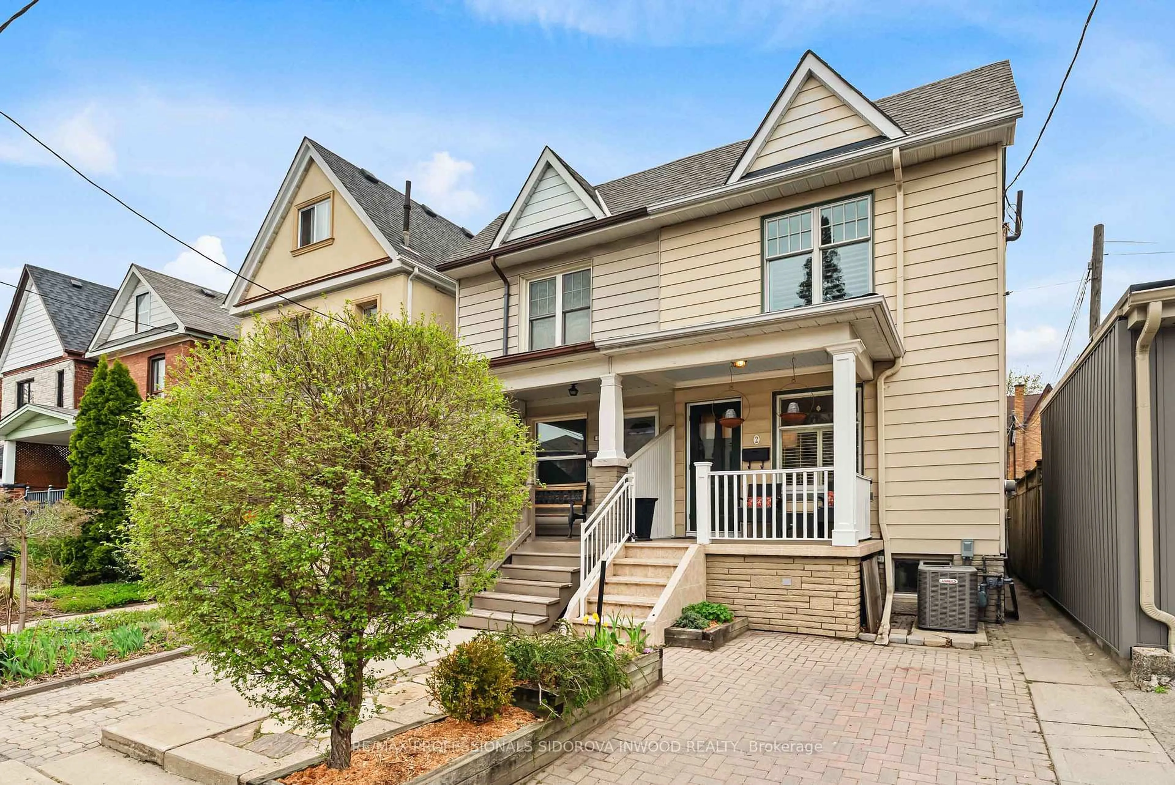 Home with vinyl exterior material, street for 2 Morland Rd, Toronto Ontario M6S 2M8