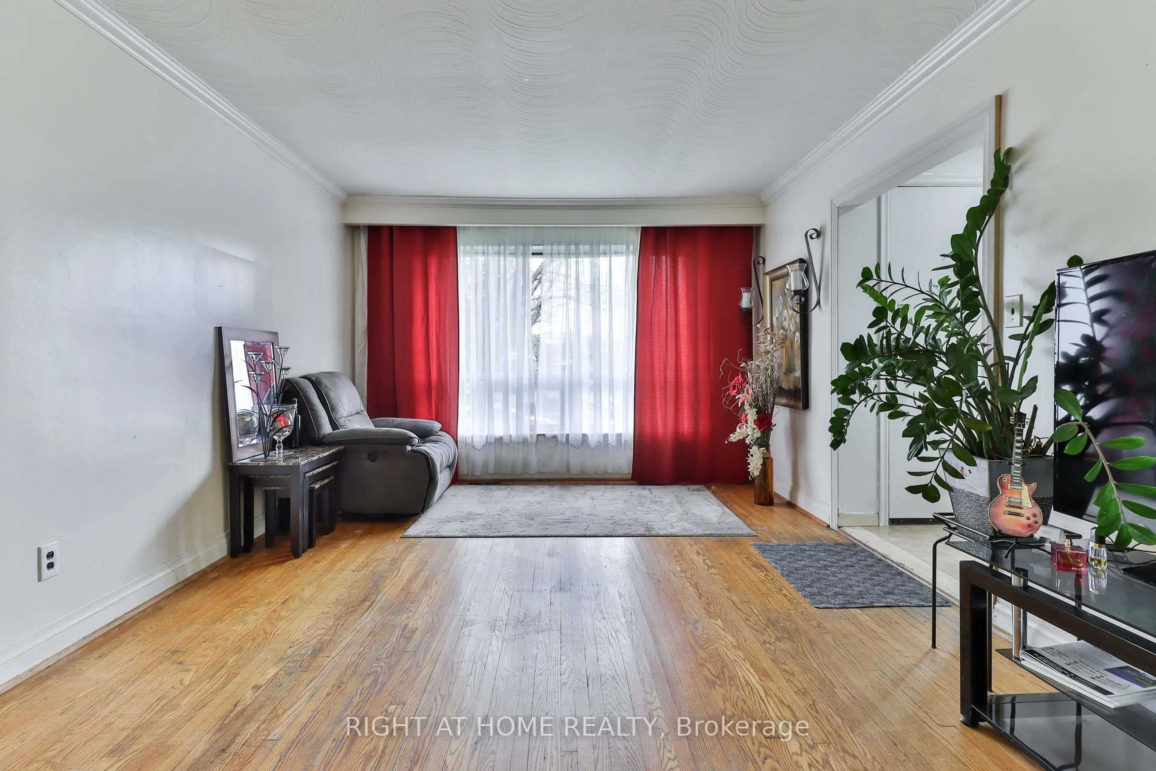 Living room with furniture, wood/laminate floor for 14 Midden Cres, Toronto Ontario M9R 3L8