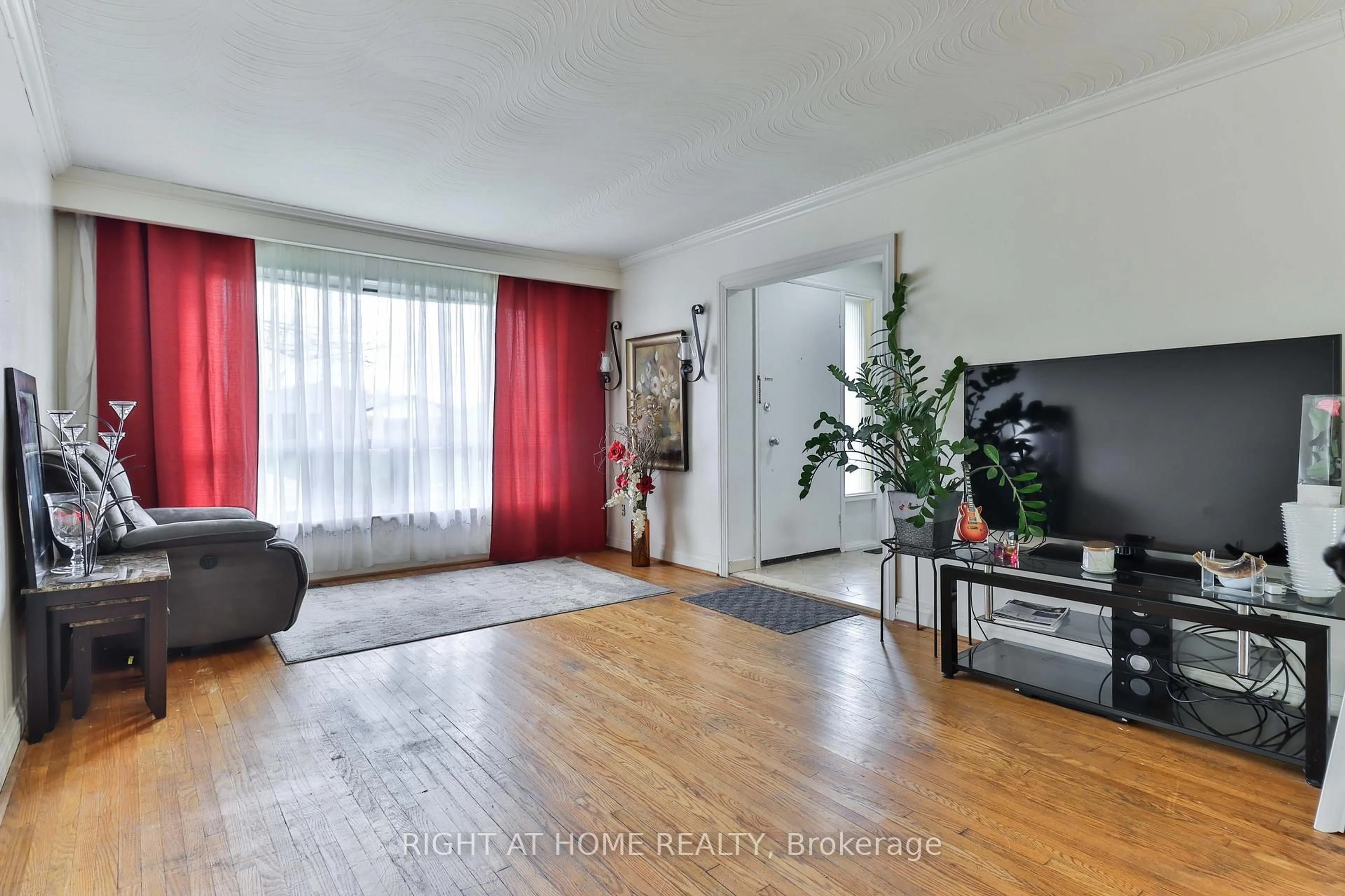 Living room with furniture, wood/laminate floor for 14 Midden Cres, Toronto Ontario M9R 3L8