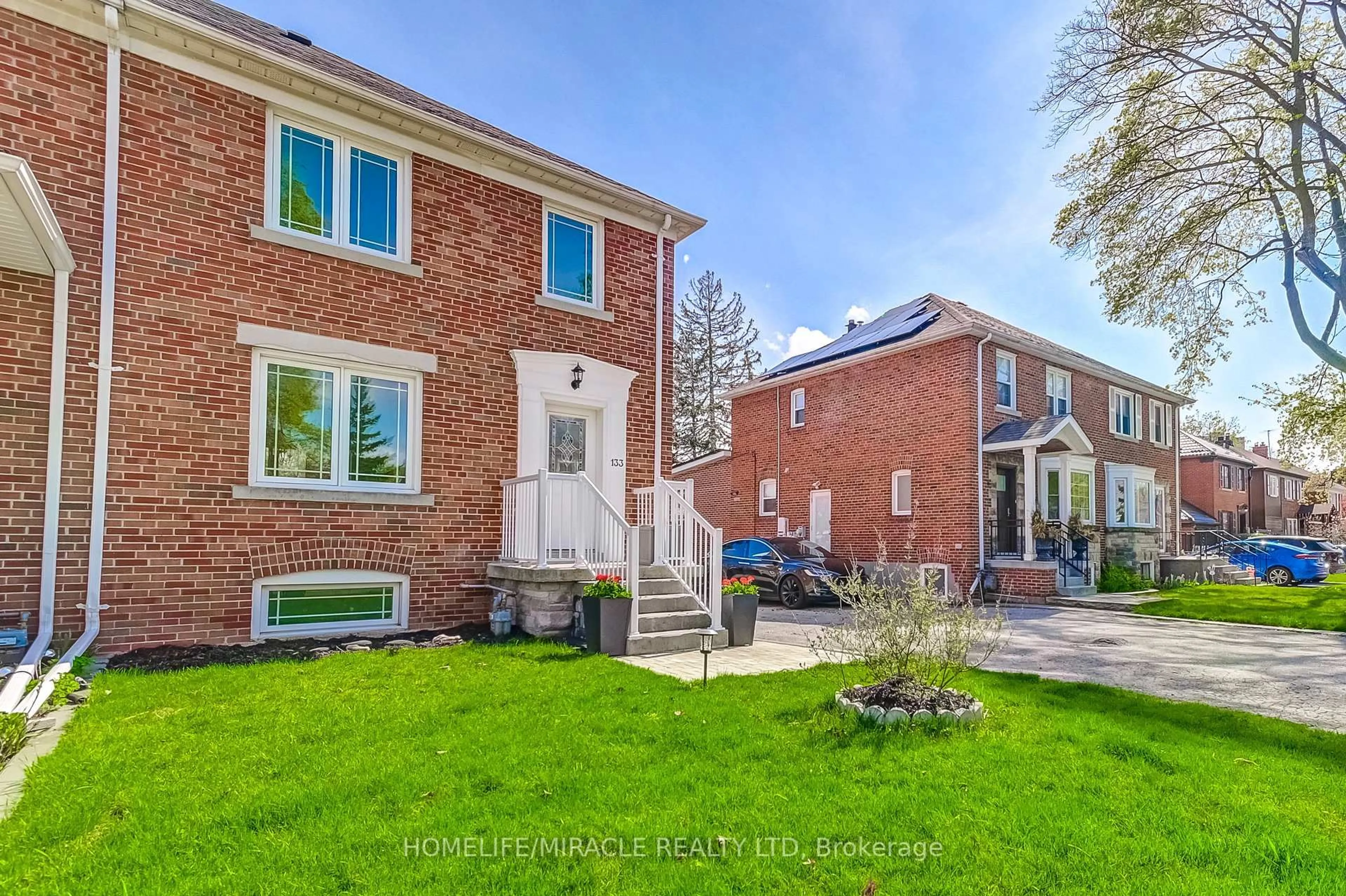 Home with brick exterior material, street for 133 Queens Dr, Toronto Ontario M9N 2H5