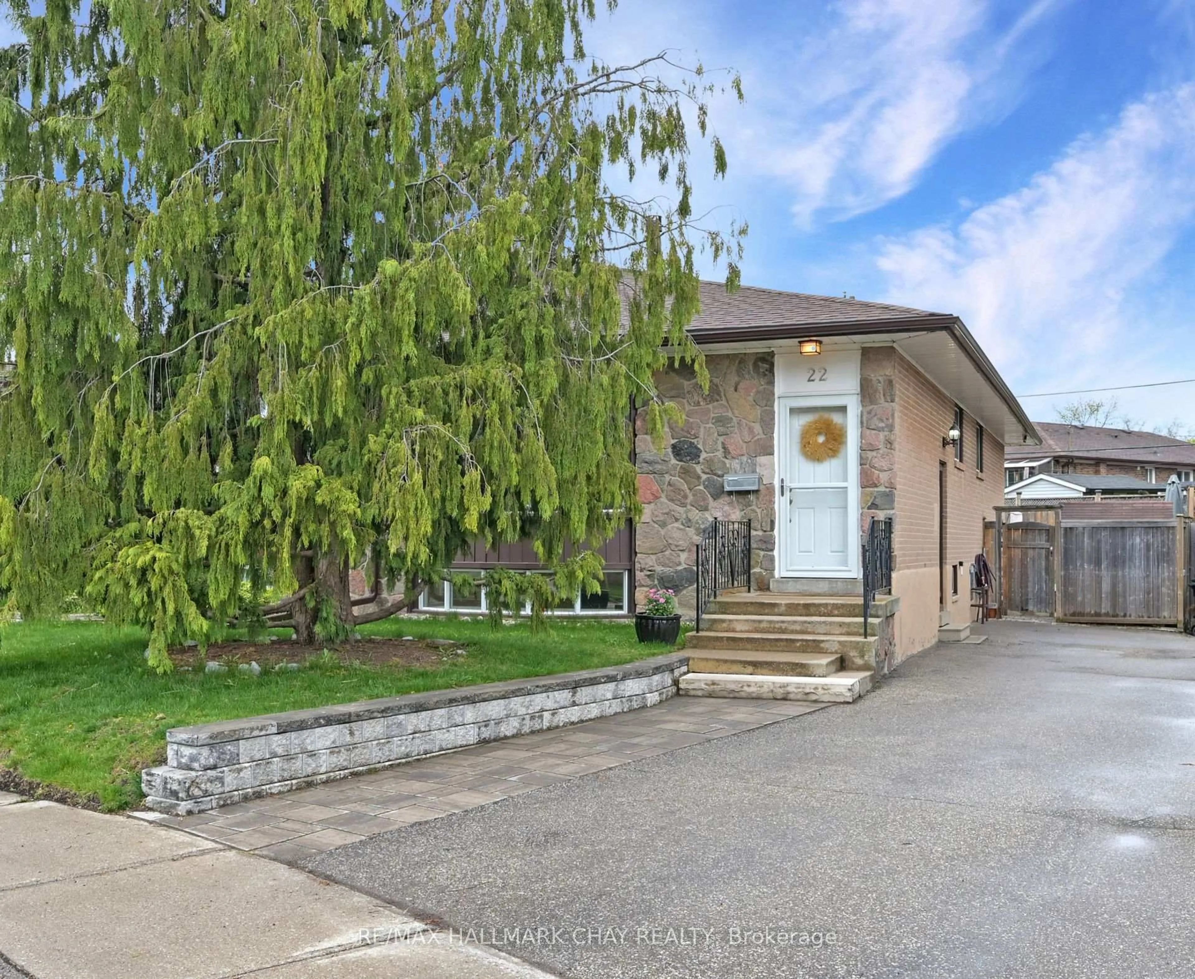 Home with brick exterior material, street for 22 Guernsey Dr, Toronto Ontario M9C 3A6