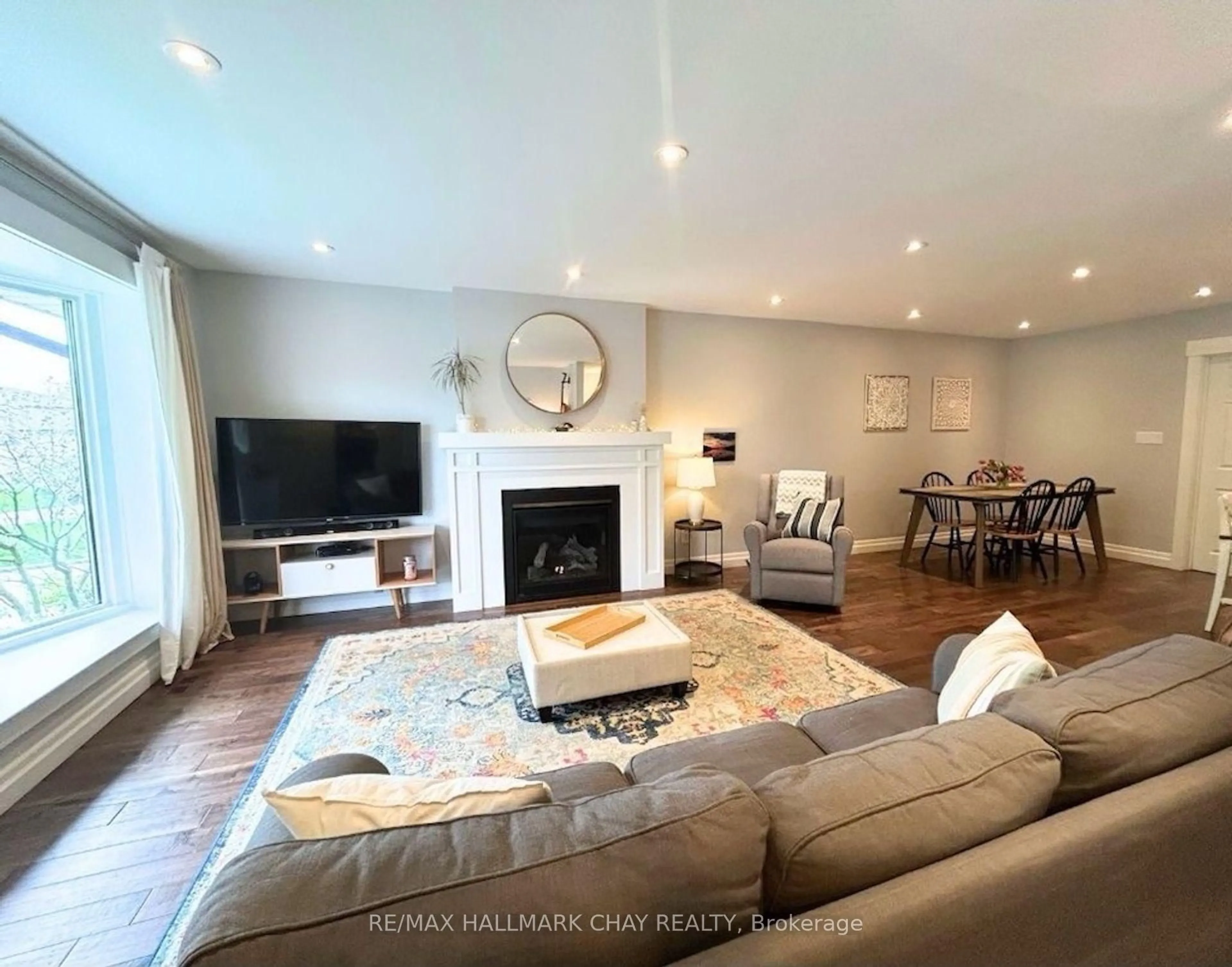 Living room with furniture, wood/laminate floor for 22 Guernsey Dr, Toronto Ontario M9C 3A6
